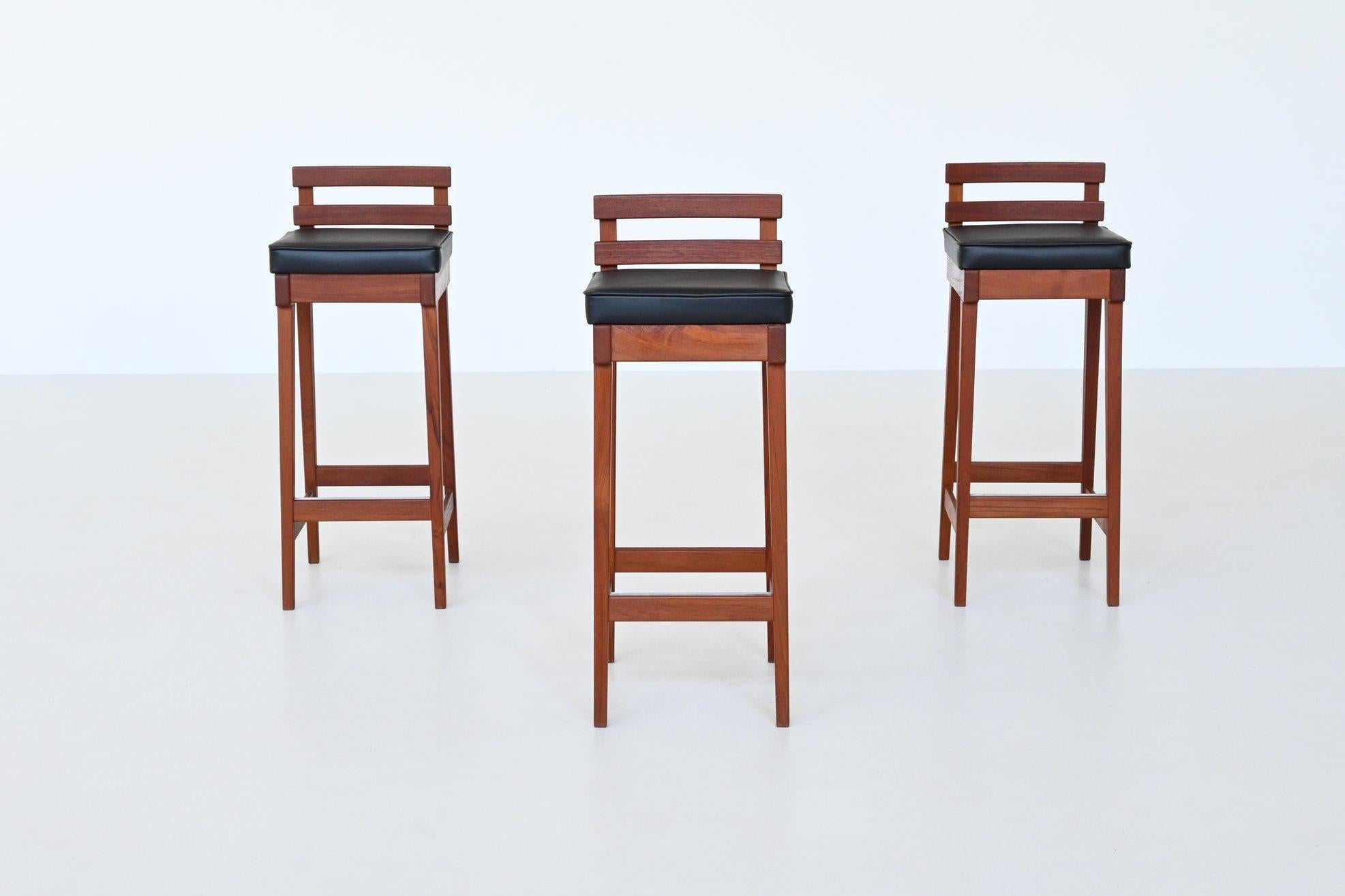 Danish Erik Buck set of three bar stools in teak and leather Dyrlund Denmark 1960 For Sale
