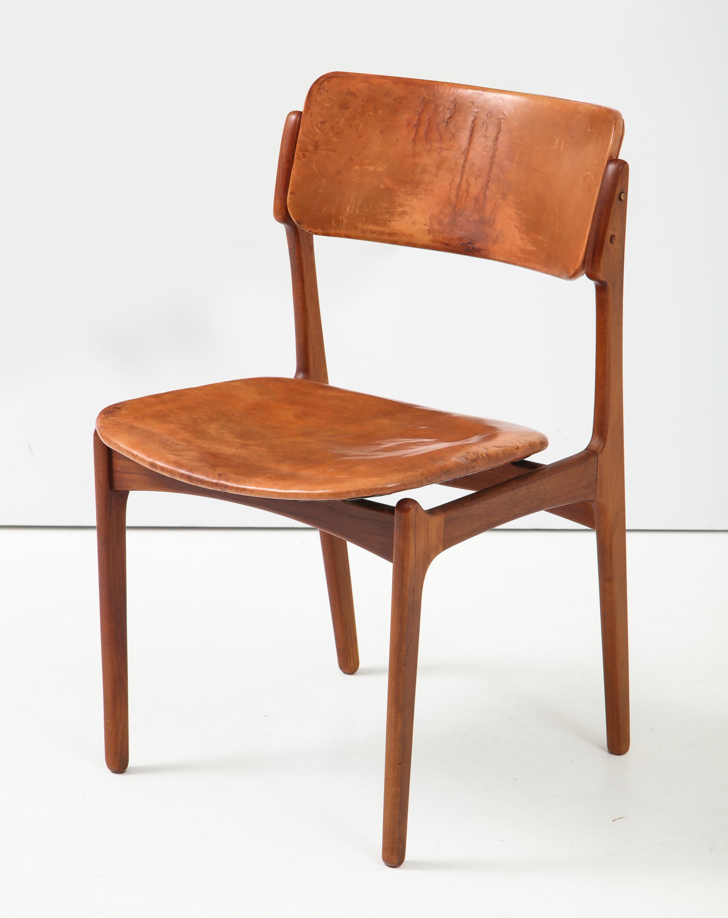 Model 49 chair by Danish designer Erik Buck, made by the Poul Dinesen cabinet shop, circa 1950s. An early example of this classic design, with great character and patina, pre-dating the mass production run by Oddense. With pegged butt joints,