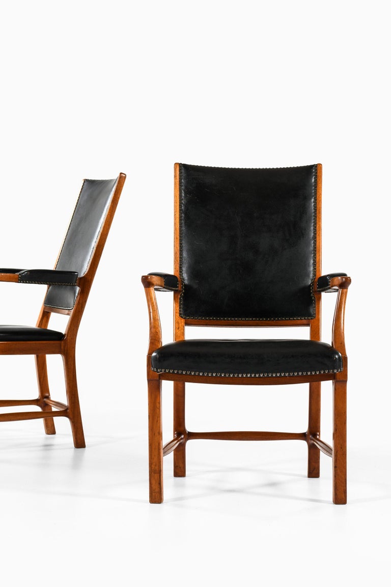 Rare pair of armchairs designed by Erik Chambert. Produced by Chamberts Möbelfabriker in Norrköping, Sweden.