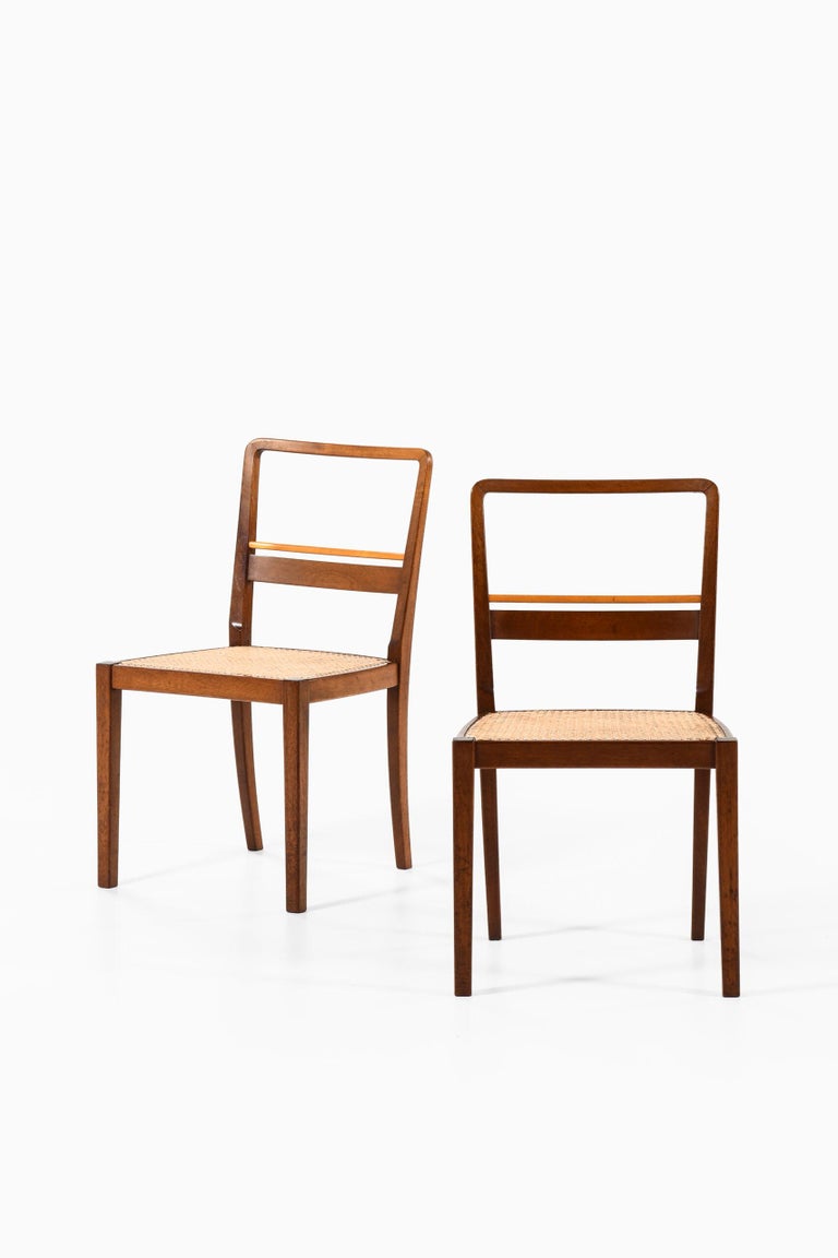 Rare set of 6 dining chairs designed by Erik Chambert. Produced by AB Chamberts Möbelfabrik in Norrköping, Sweden.