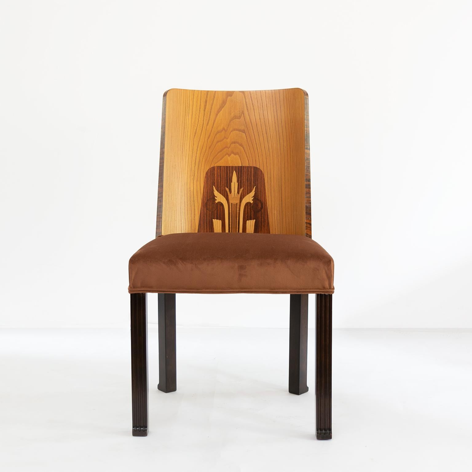 Erik Chambert set of 6 Swedish Art Deco side chairs. Designed in the late 1920s-early 1930s these chairs have rectangular carved legs with stylized feet. The inner backs have a variety of woods including elm and rosewood depicting a symmetrical