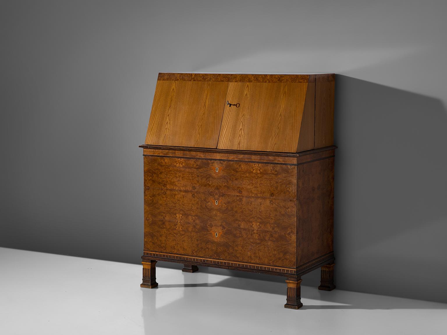 Erik Chambert for Chamberts Möbelfabrik, secretary, inlayed birch, elm and rosewood, Sweden, 1930s

This Swedish secretary was designed by Erik Chambert during the 1930s. It features a high level of craftsmanship, with a wide variety of different
