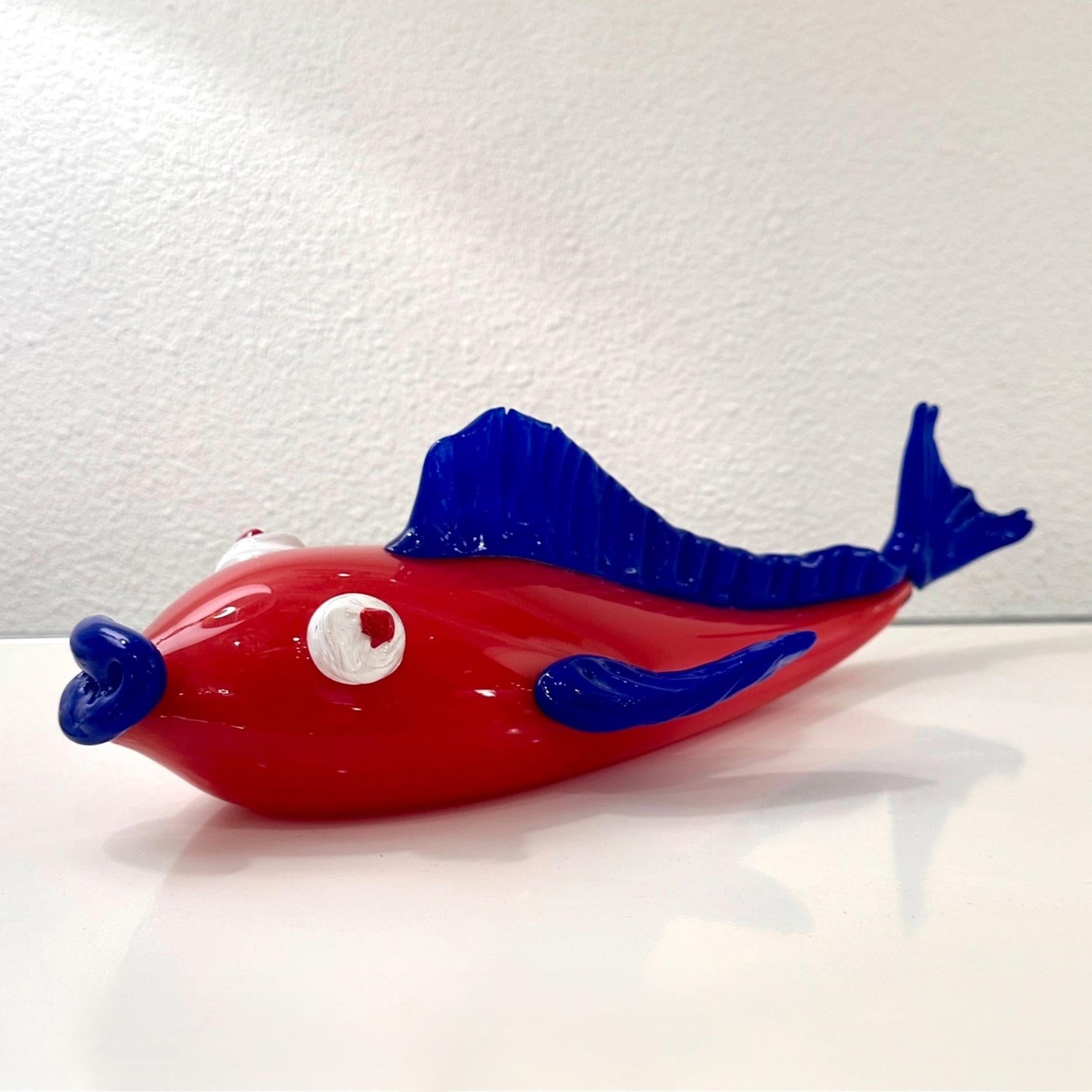 Erik Eiserling California Red and Blue Art Glass Fish, ca 2000s

Adorable red and blue art glass fish with white eyes. Created by California artist Erik Eiserling in the early 2000s. A fun decorative item.

Measures 5