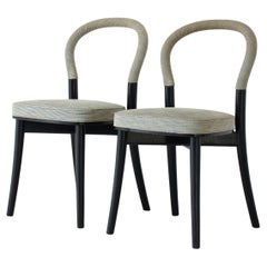 Erik Gunnar Asplund's elegant set of 8 chairs in wood and fabric covering