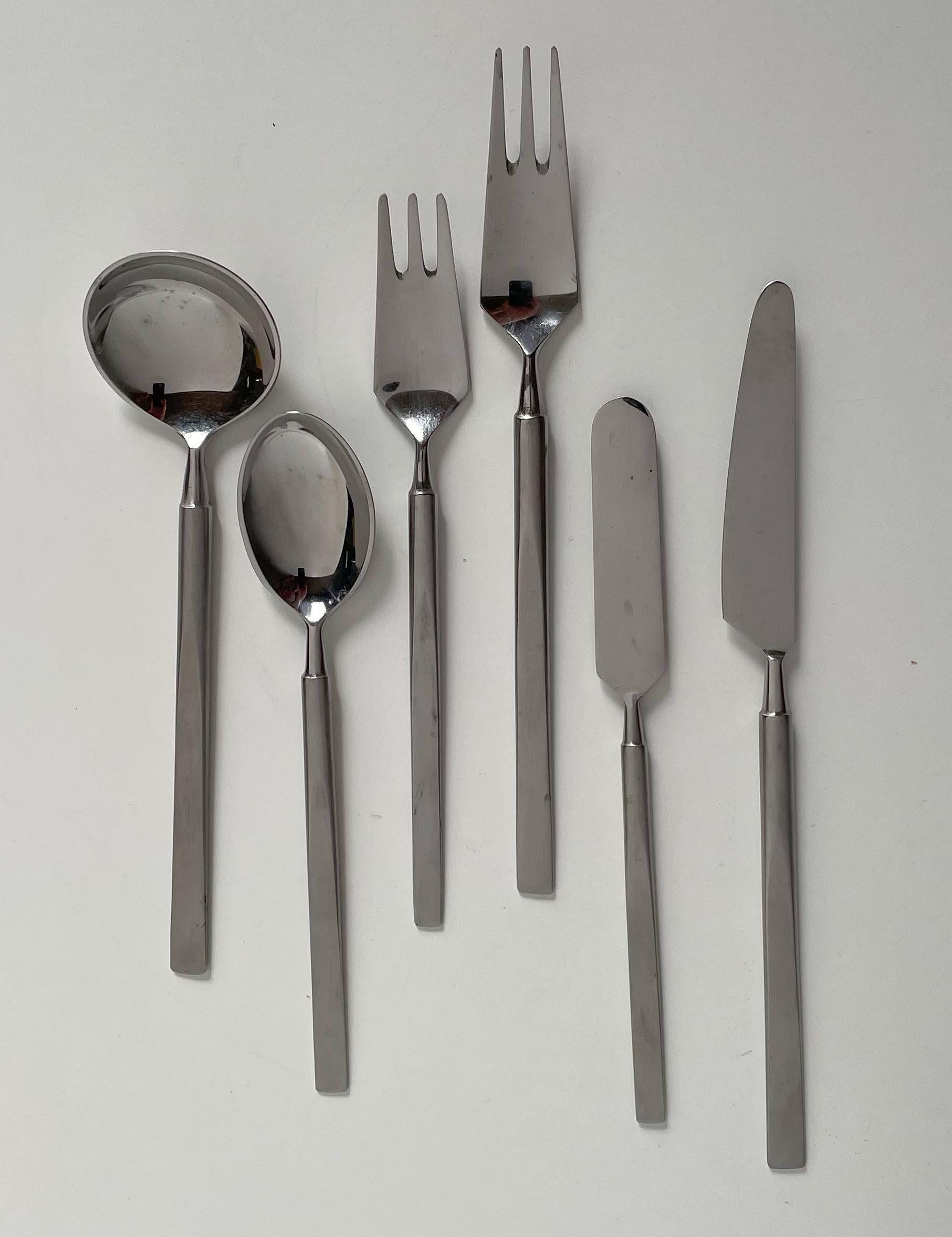 'Obelisk' flatware set designed in 1954 by Erik Herlow for Universal Steel of Denmark and retailed worldwide by Georg Jensen. Each technically innovative piece was wrought from a single piece of 18/8 stainless steel, then hand-finished with a