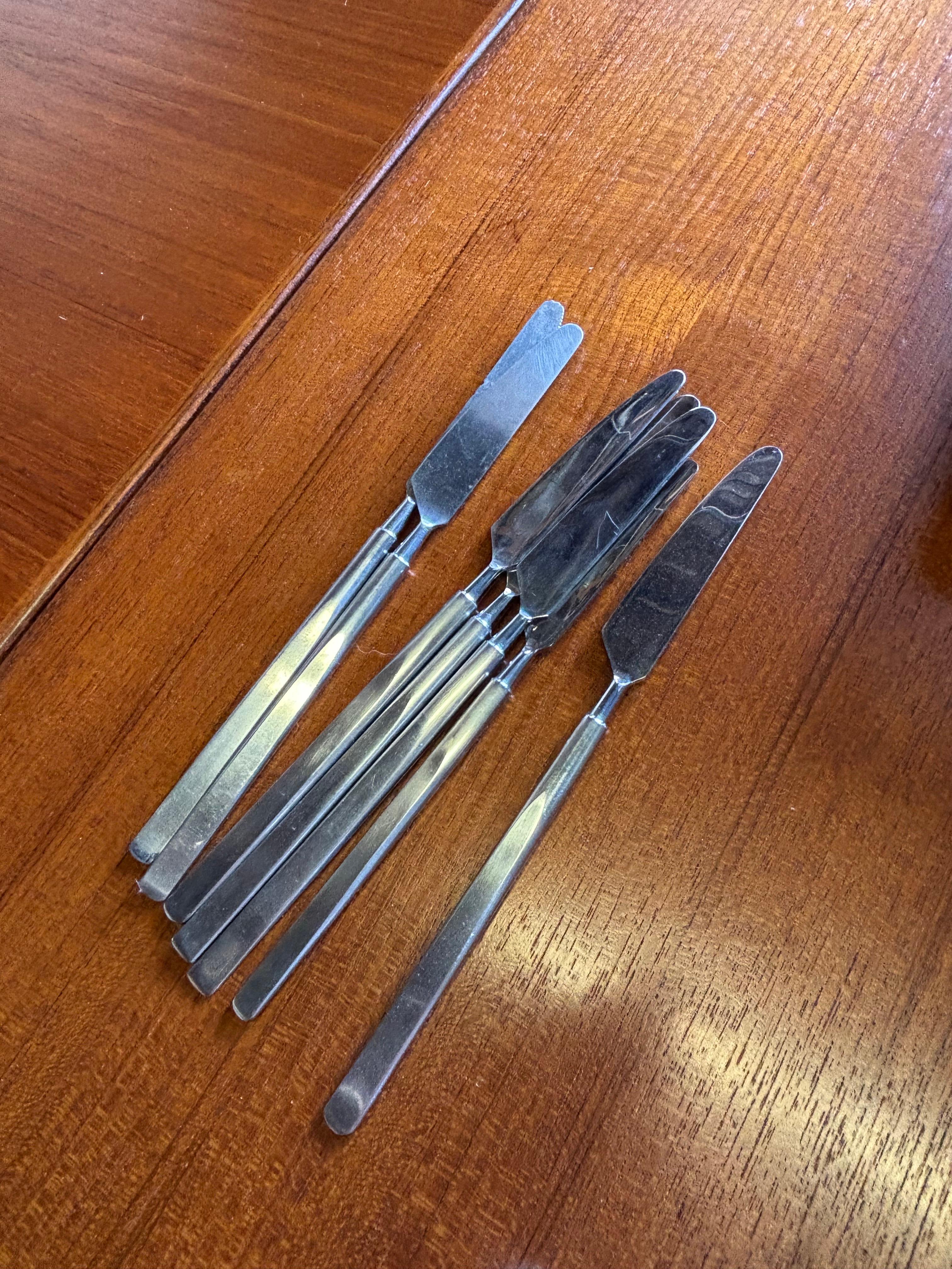 Erik Herlow Stainless Flatware Set.  Service for 8 plus extra pieces!  Overall clean set that shows normal signs of use and wear.  Satin Handles with Brite Chrome Ends!