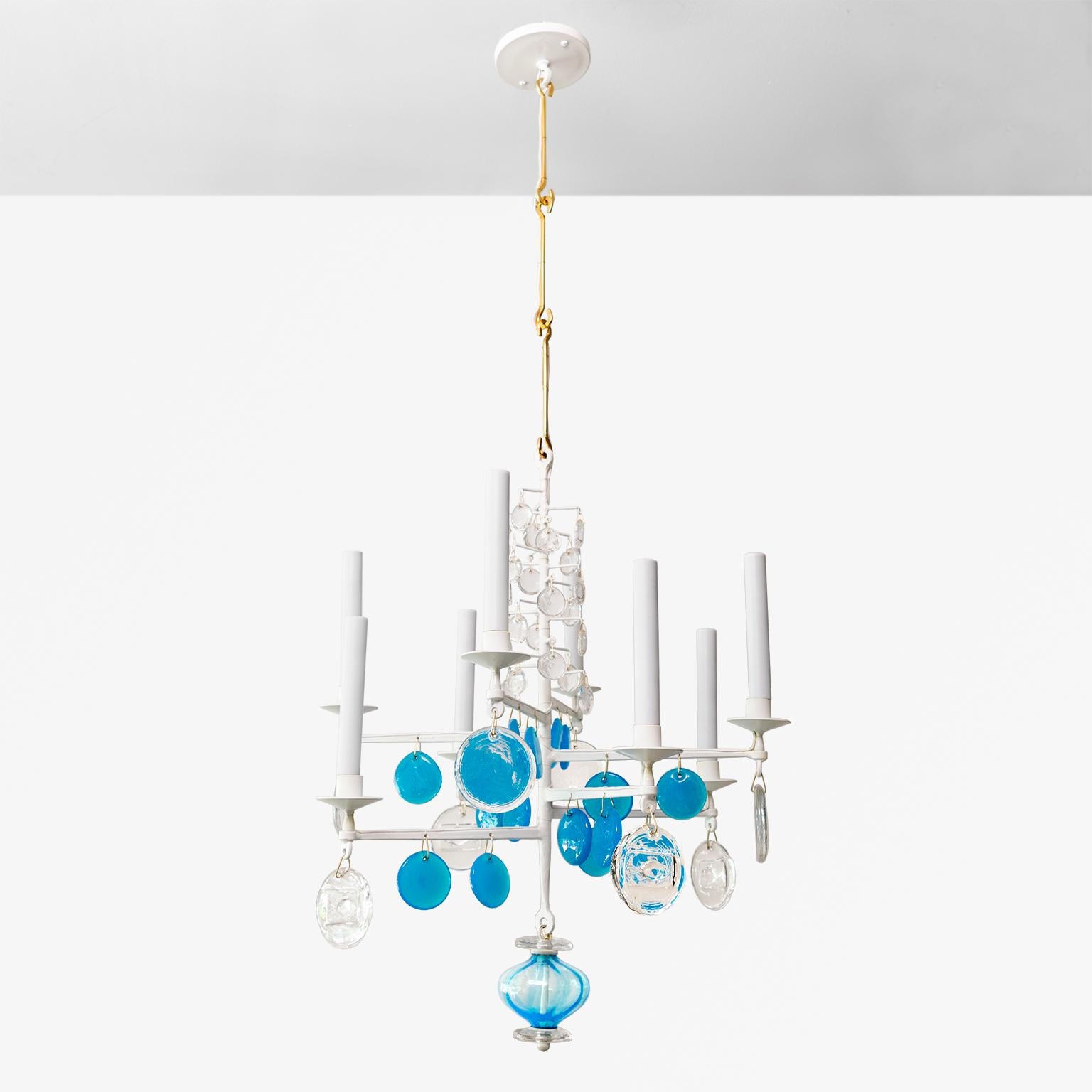 Erik Hoglund electrified 8-light chandelier of painted wrought iron with clear and blue glass crystals, Made by Boda Nova Glassworks/Axel Stromberg Ironwork, circa 1960, Sweden.

Measures: Height 44