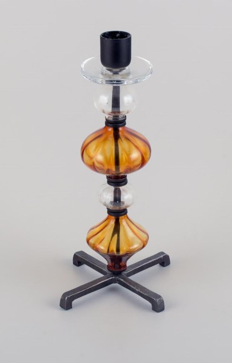 Erik Höglund for Kosta Boda. Tall candlestick holder made of mouth-blown glass and cast iron.
Produced in the 1970s.
In excellent condition.
Dimensions: H 36.0 cm x D 18.5 cm (base).
Suitable for candles with a diameter of 33mm.