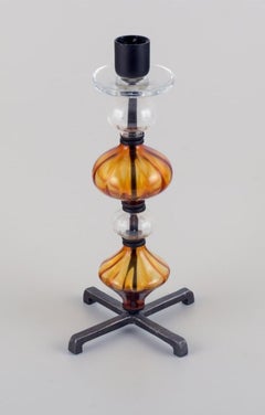 Erik Höglund for Kosta Boda. Tall candlestick holder made of glass and cast iron