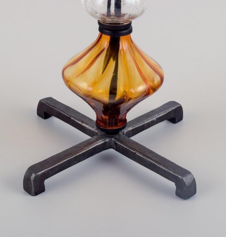 Erik Höglund for Kosta Boda. Tall candlestick holder made of glass and cast iron In Excellent Condition For Sale In Copenhagen, DK
