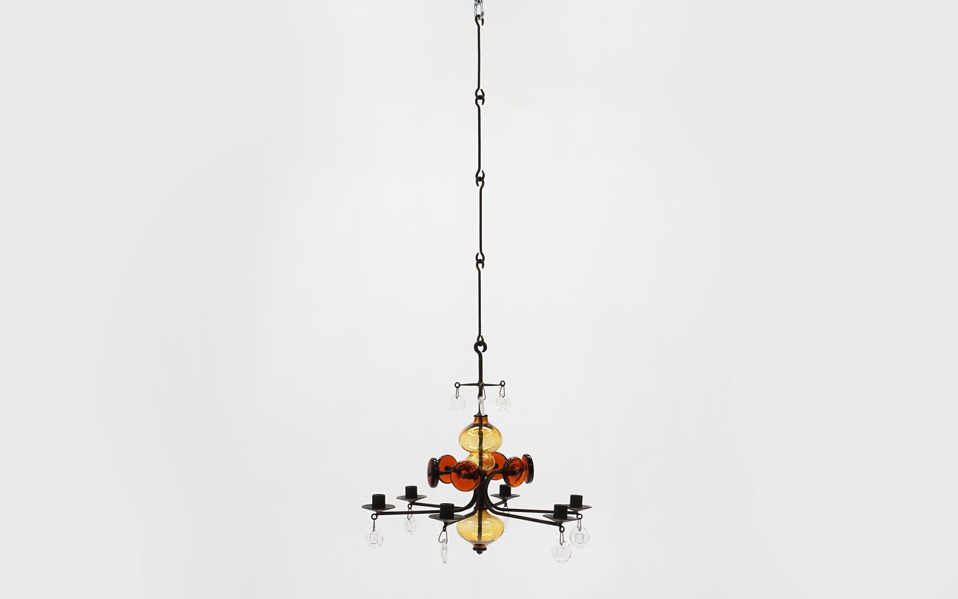 Erik / Eric Hoglund hanging candelabra / candelabrum / pendent / chandelier. Blown glass and wrought iron. Includes four original drop down extensions. This is an excellent example of this design. Great colors in amber, orange, and clear glass.