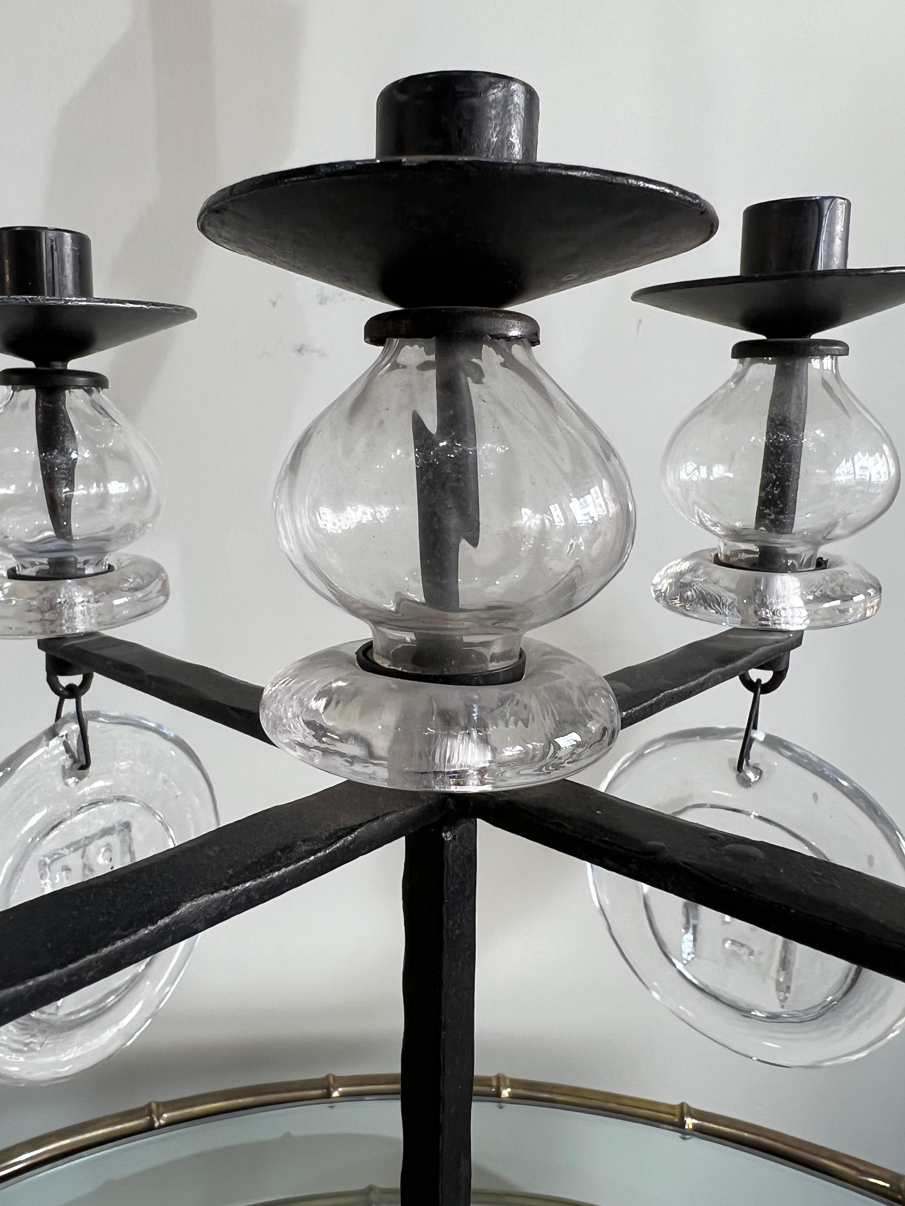 A wrought iron candelholder five lights by Erik Hoglund Sweden, circa 1970
Very large glass pendants.