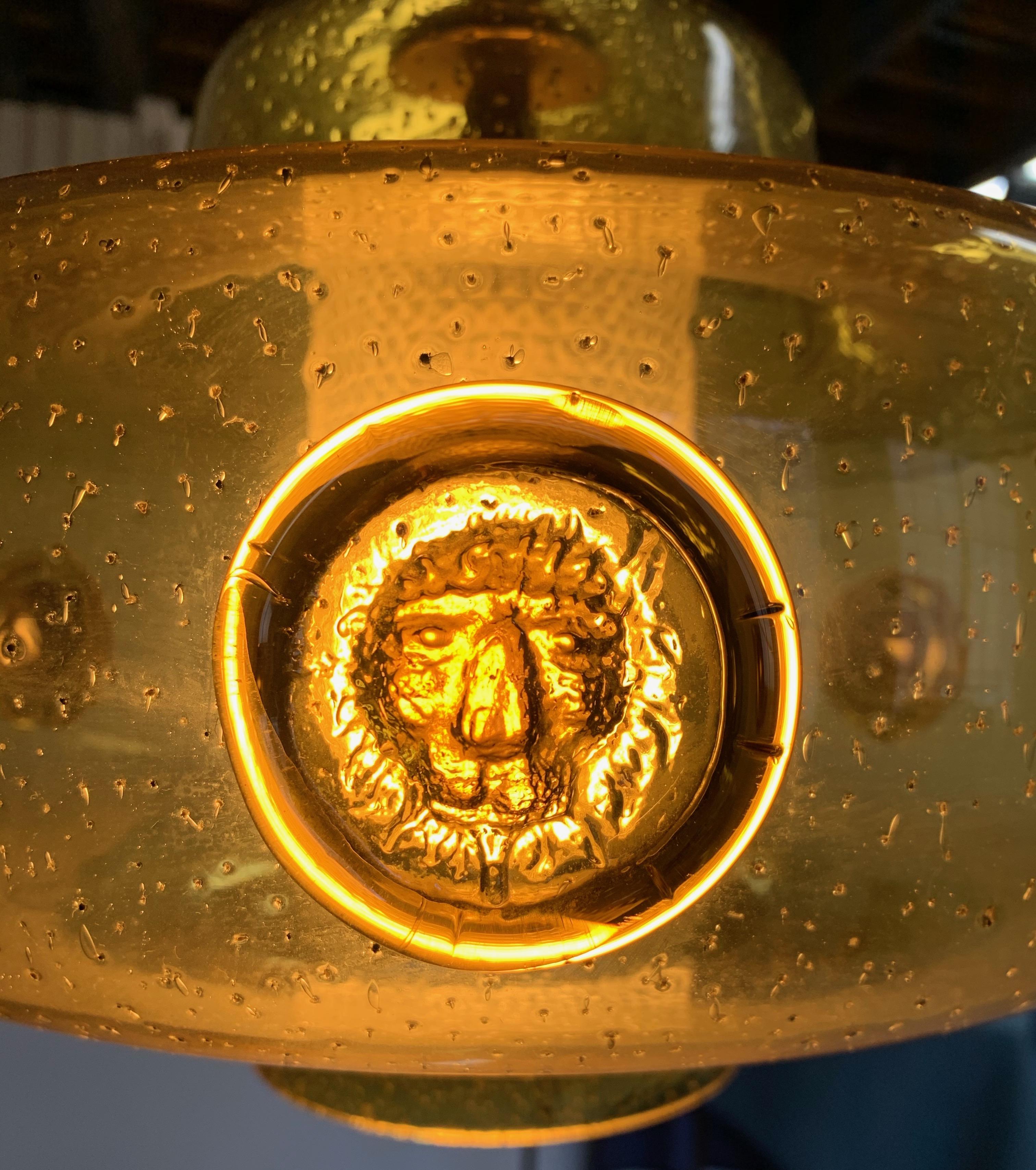 Erik Hoglund signature glass with his Classic pendants featuring lions! Golden color with trademark hand blown bubbles. Interior glass shade with diamond pattern is in perfect condition.