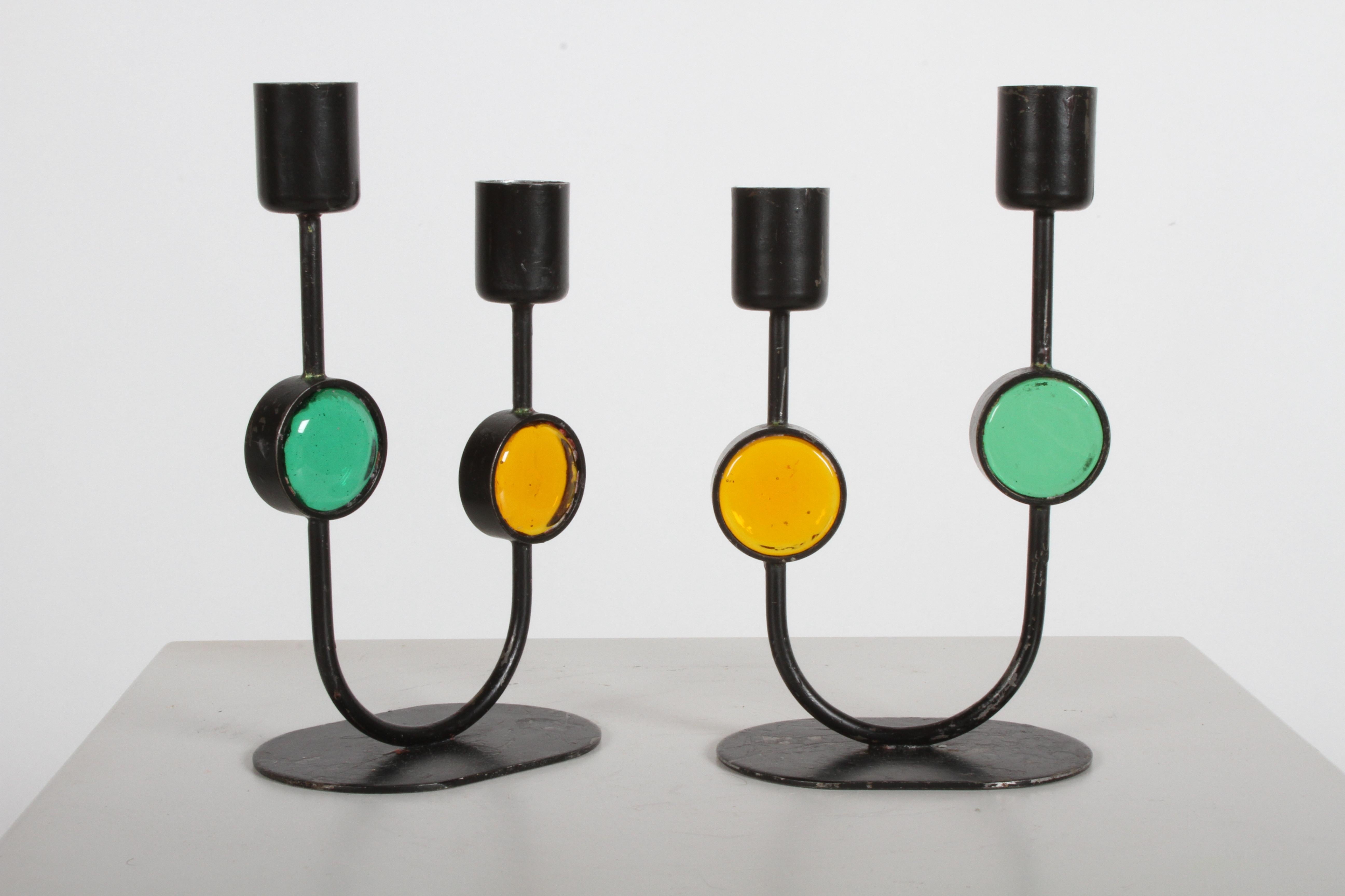 Pair of Erik Höglund designed art glass and iron candle holders / candelabra , made by Ystad- Metall Sweden. Wear to black paint, and wax residue, otherwise fine condition.