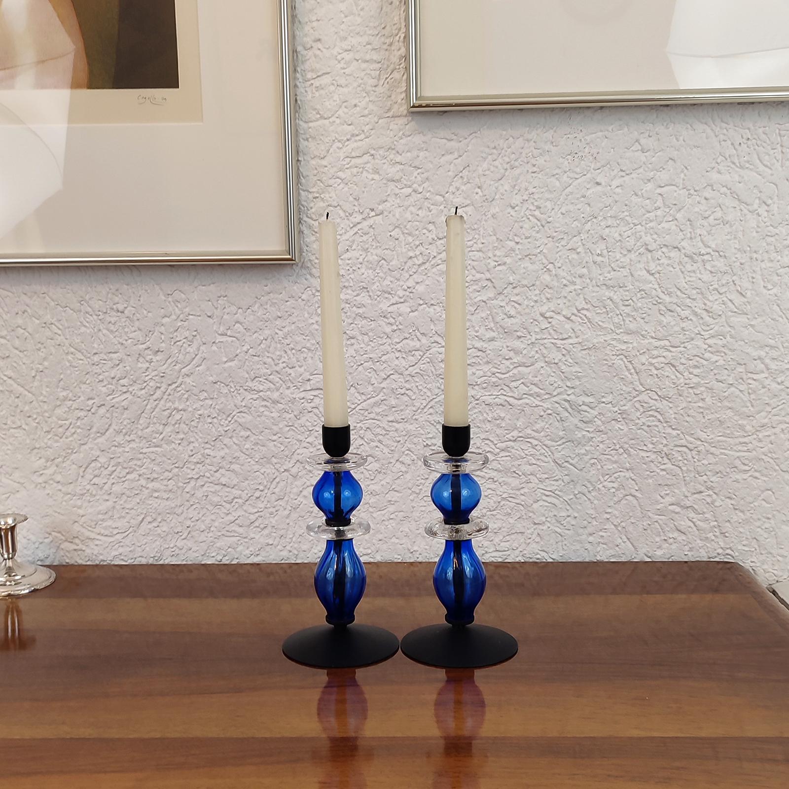 Mid-Century Modern, Swedish, pair of candle holders, black painted metal and blue art glass.
Beautiful pair of candle holders, designed by Erik Hoglund for Boda, Sweden. Base and top made of black painted metal. Body made of ribbed blue art glass