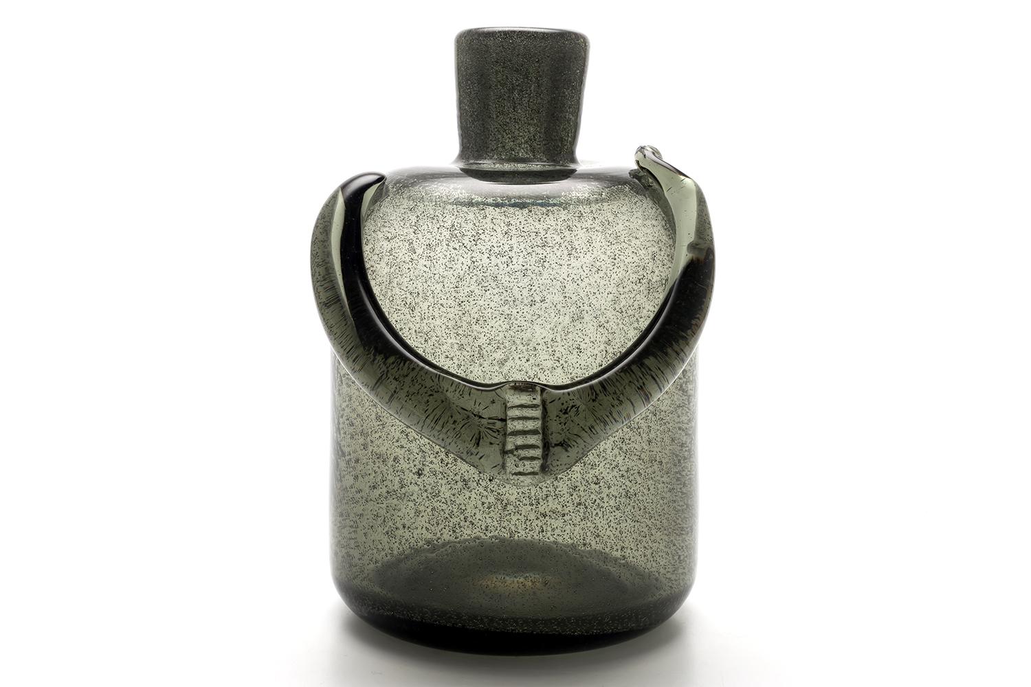 Launched in 1956, this series uses tiny granules of carborundum (silicon carbide) instead of the potato or sawdust that had previously been used to create bubbles.

Carborundum is a hard compound that is also used as an abrasive.
Even when mixed