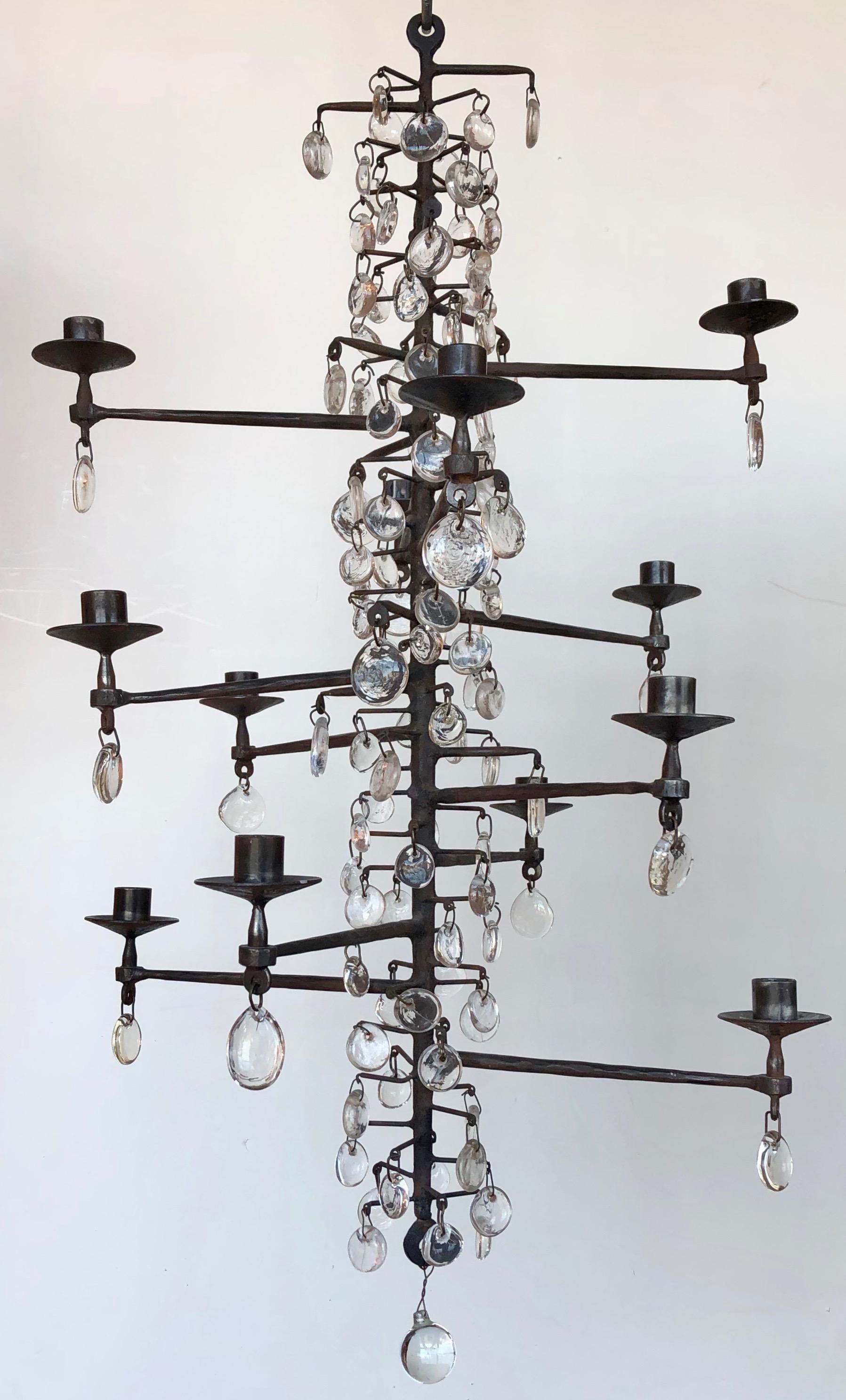 Erik Hoglund twelve candle chandelier with wrought steel structure and blown glass pendants.