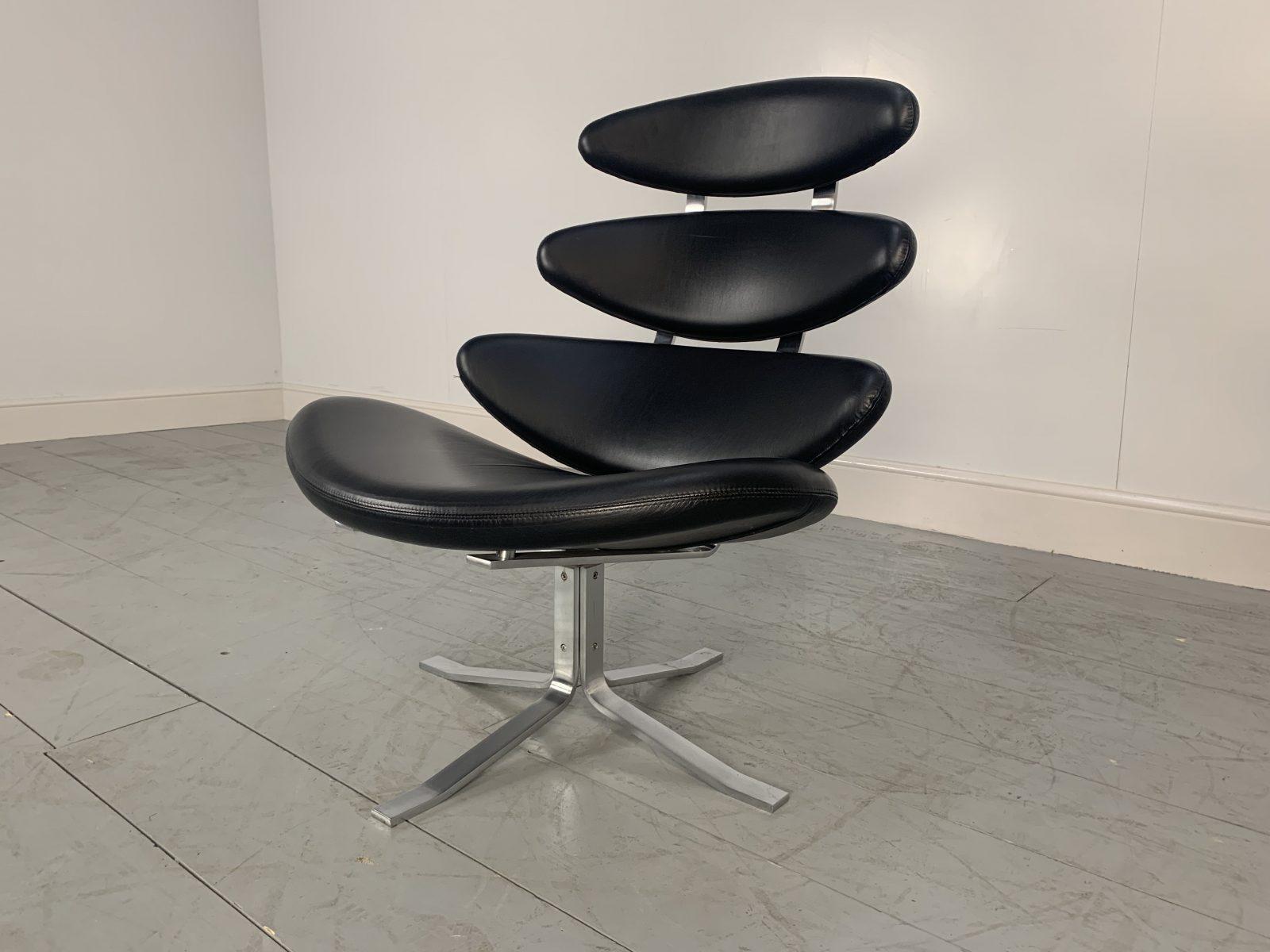 Hello friends, and welcome to Lord Browns Furniture.

On offer on this occasion is a rare, striking “EJ5 Corona” Chair dressed in Black “Apache” Leather, from the world-renown Danish furniture house of Erik Jorgensen.

As you will no doubt be