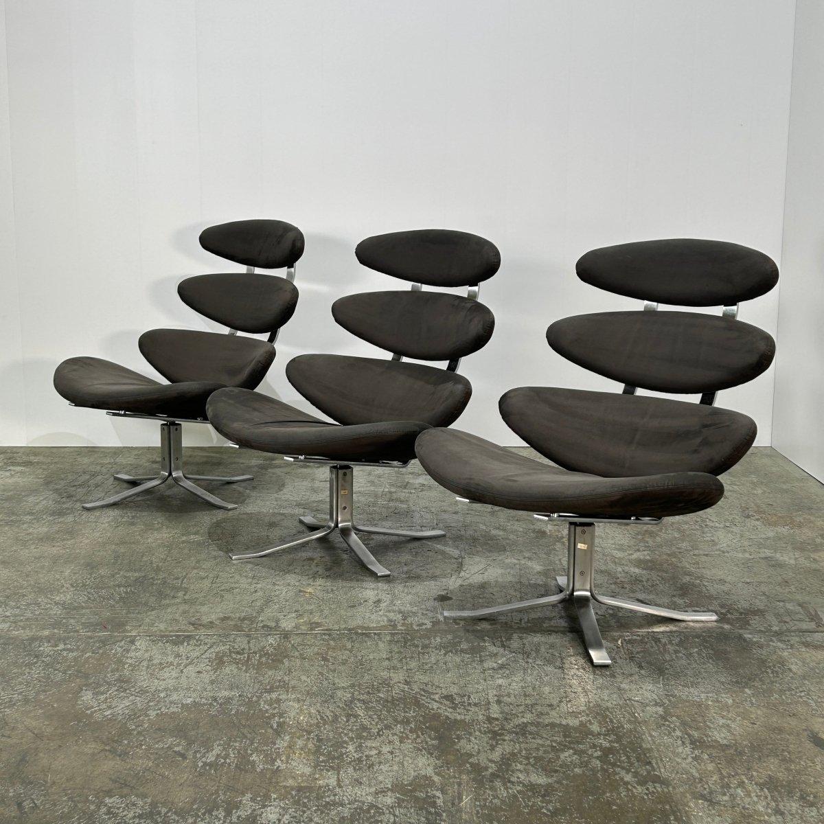 Introducing the EJ 5 Corona Chair by renowned designer Erik Jørgensen, a true masterpiece of luxury furniture. Crafted with the finest materials and impeccable attention to detail, this chair exudes sophistication and elegance. The iconic circular