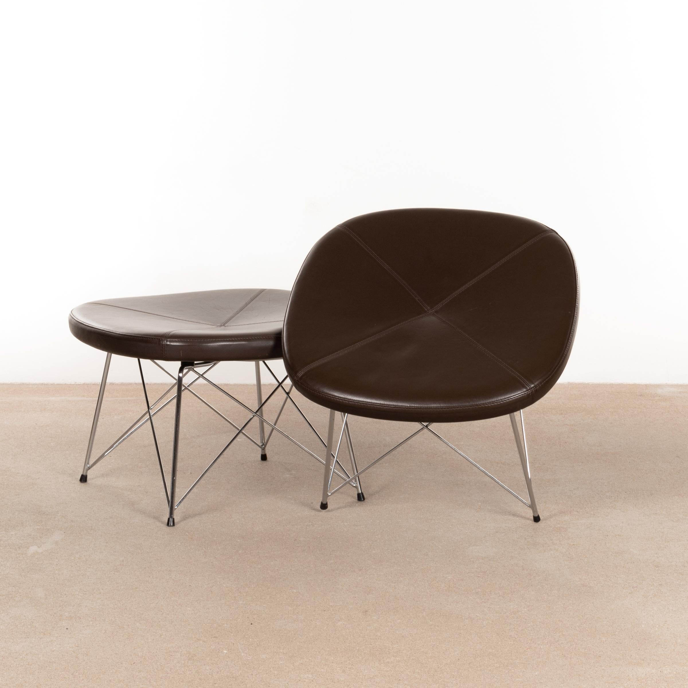 Functional stool / ottoman (Model EJ 141) designed by Anne Mette Jensen & Morten Ernst for Erik Jørgensen, Denmark. Chrome-plated rod steel bases with dark brown leather seats. Good original condition with normal and light traces of use.