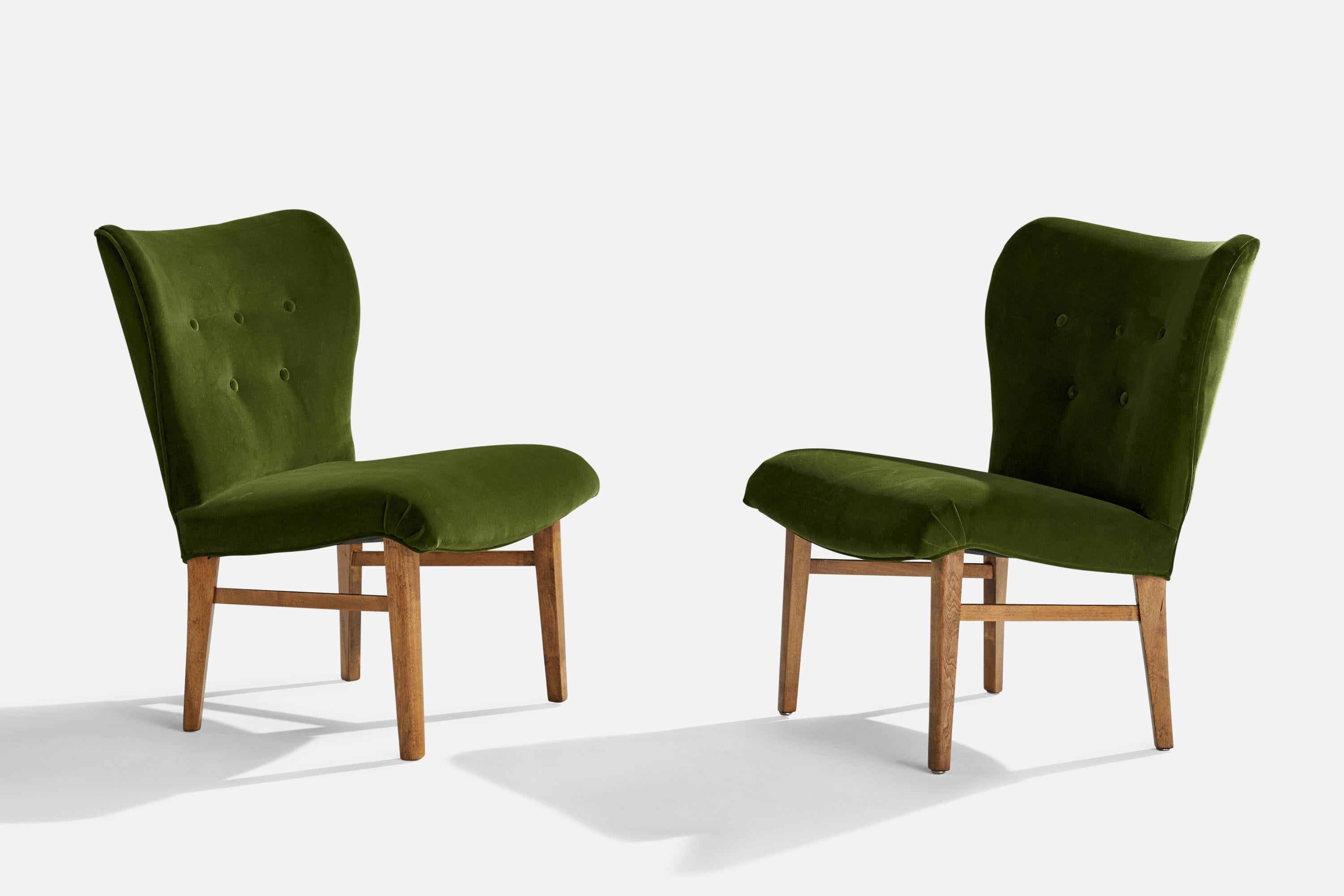 A pair of green velvet fabric and beech slipper lounge chairs attributed to Erik Karlén for Firma Rumsinteriör, Sweden, c. 1950s.

Seat height 17”.