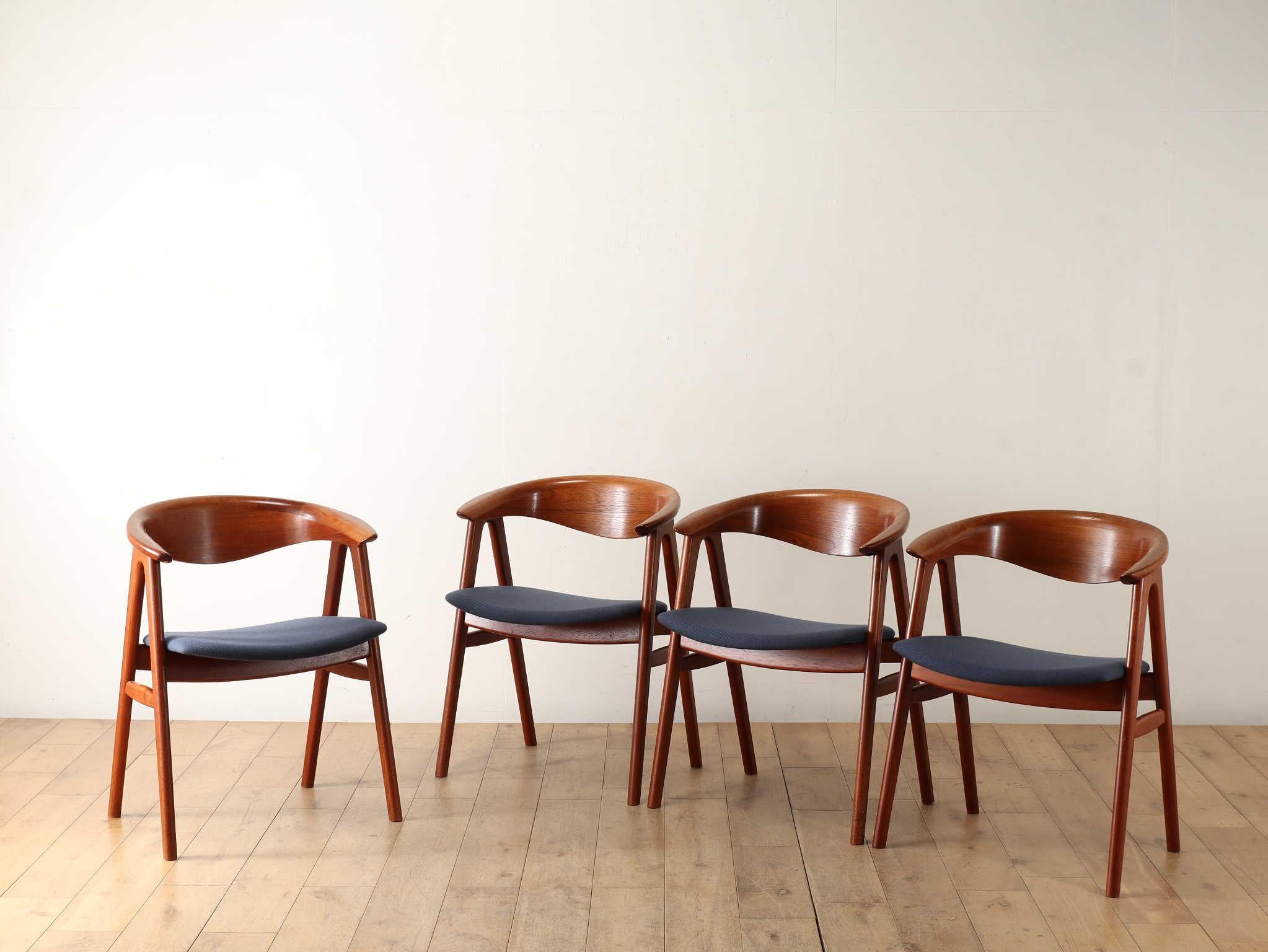 Armchair designed by ERIK KIRKEGAARD. It is characterized by a side frame reminiscent of a Saw horses. The gently curved backrest is an iconic detail of this chair. The curved line created by combining solid boards allows you to feel the depth and