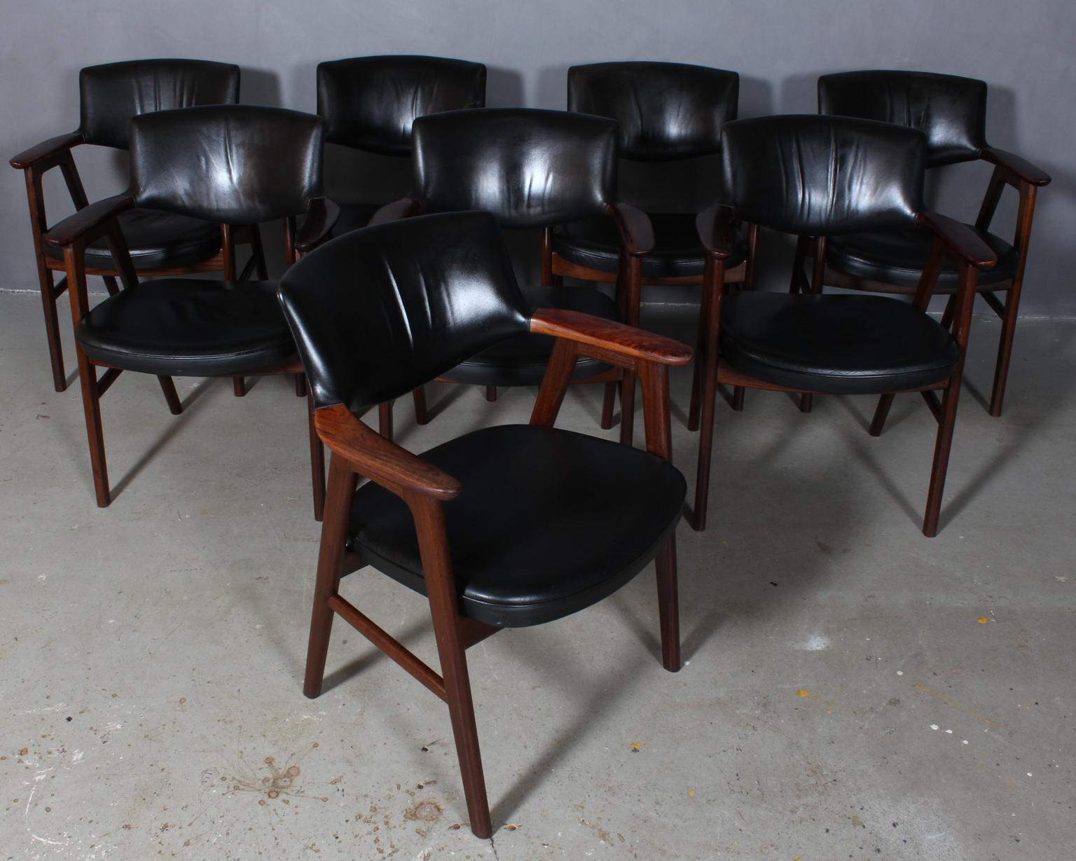 Erik Kirkegaard set of eight armchairs in rosewood.

Seat and back with black patinated leather.

Made by Høng Stolefabrik.