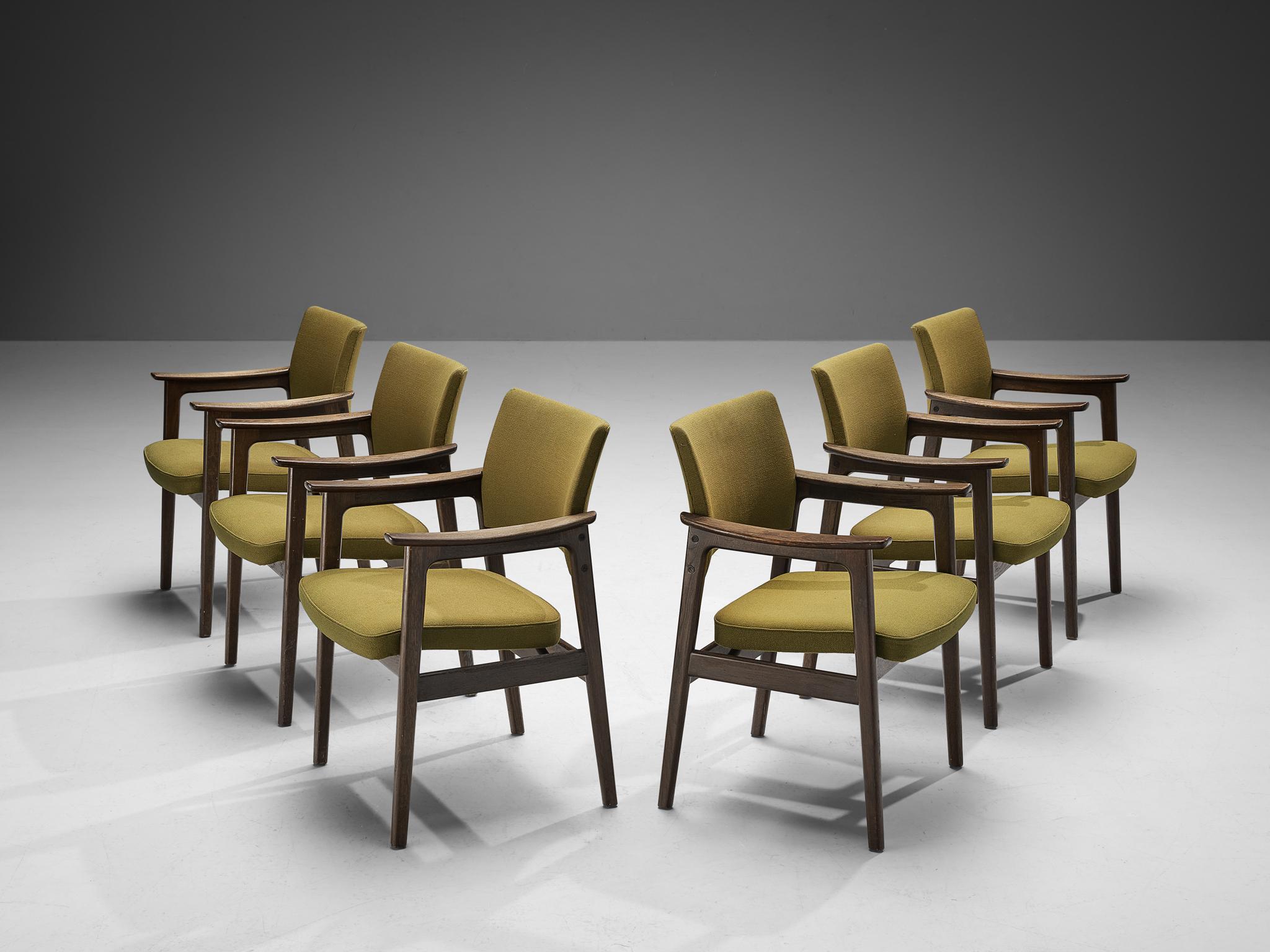 Erik Kirkegaard for Høng Stølefabrik, set of six armchairs, oak, fabric, Denmark, 1960s

This set of dining chairs are sculpturally structured embodying delicate round shapes and sturdy lines. The curved shape can be recognized in both the armrests