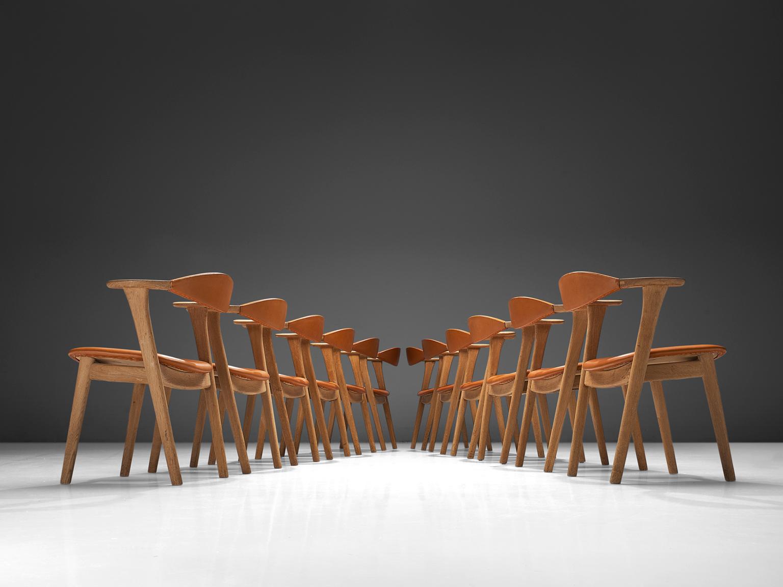 Danish Erik Kirkegaard Set of Twelve Oak and Leather Chairs