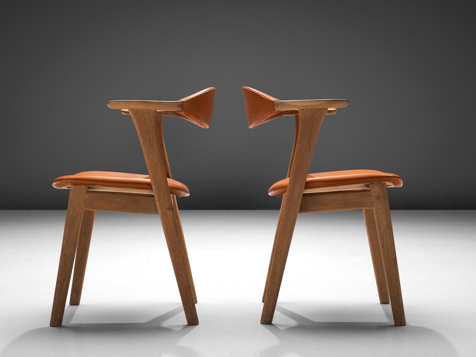 Mid-20th Century Erik Kirkegaard Set of Twelve Oak and Leather Chairs