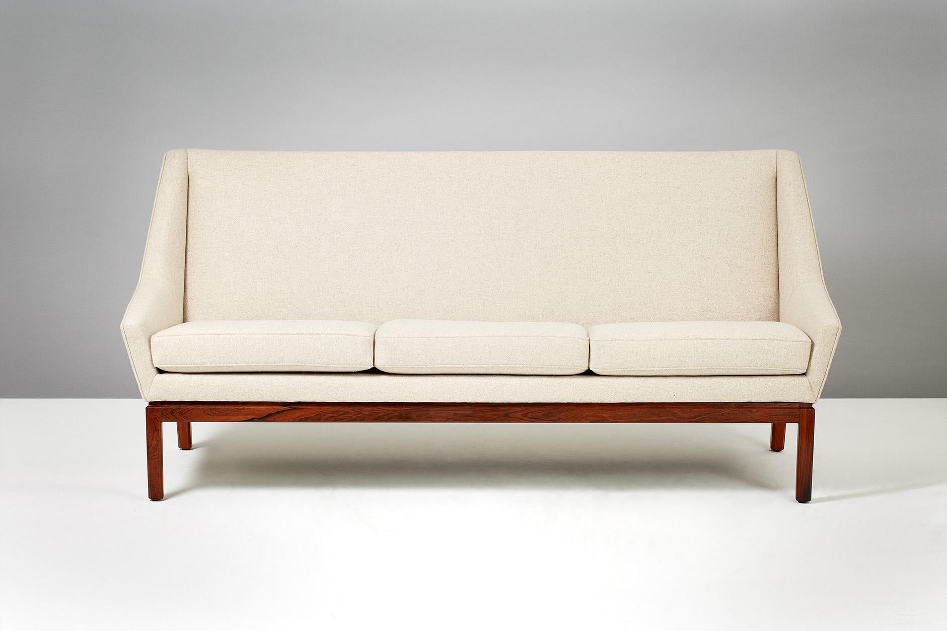 Sofa produced by master cabinetmaker Peder Pedersen with rosewood base. New upholstery in Kvadrat Divina wool fabric. 

