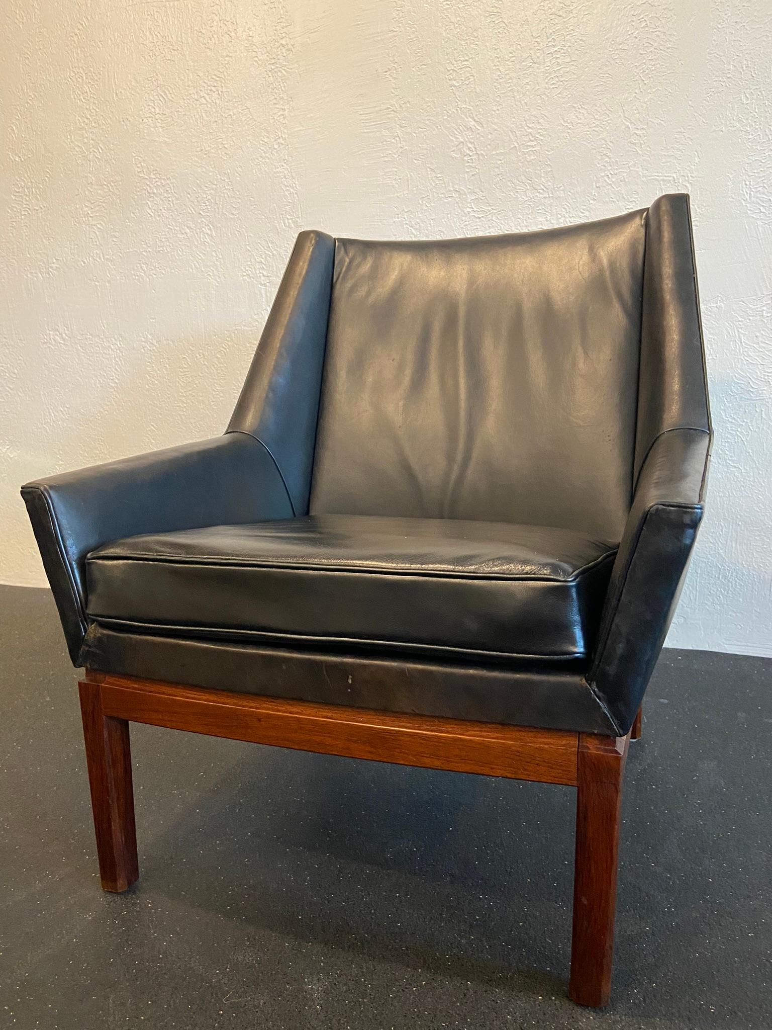 Erik Kolling Andersen for Peder Pedersen easy chair. Original black leather with warm patina on a rosewood base. Seat cushion has been redone in an almost seamlessly matched leather. Areas of wear to leather but no rips or tears (please refer to