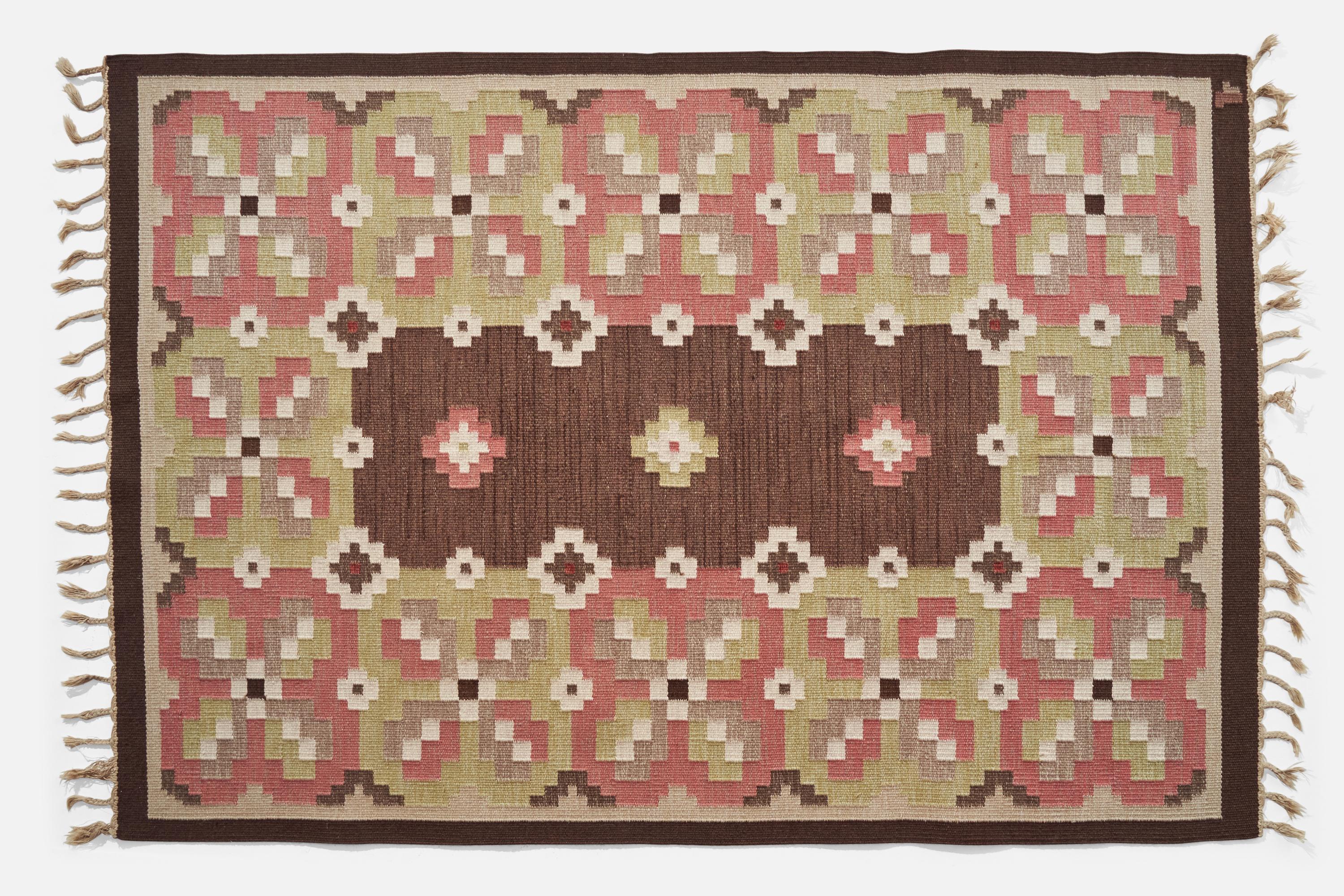 A brown, green and pink-dyed flatweave wool carpet designed by Erik Lundberg and produced by Vävaregården, Sweden, c. 1950s.