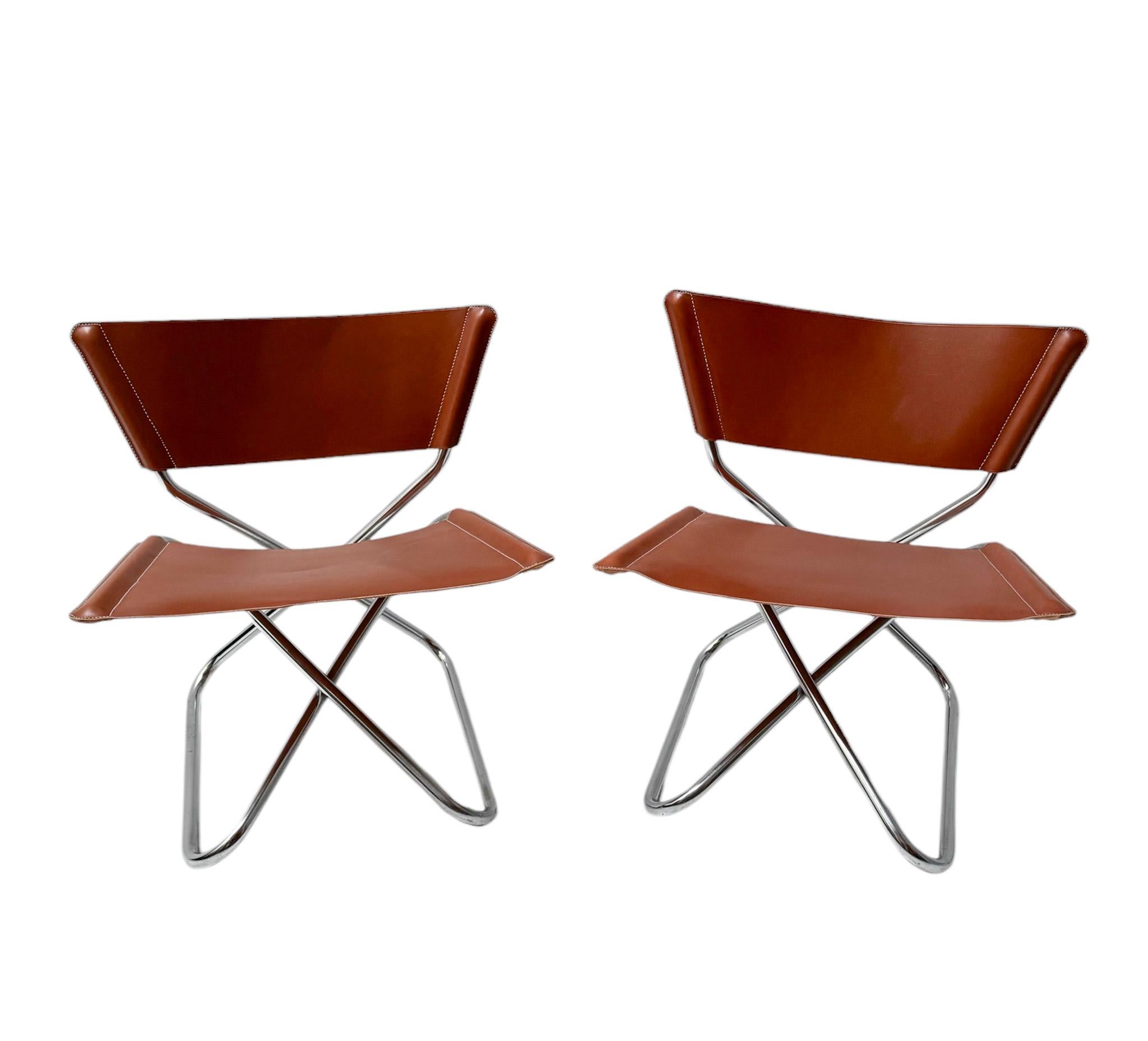 Magnificent and rare pair of Mid-Century Modern Z Down lounge chairs.
Design by Erik Magnussen for Torben Ørskov Denmark.
Striking Danish design from the 1960s.
Original chrome tubular steel frames and re-upholstered with four new cognac saddle