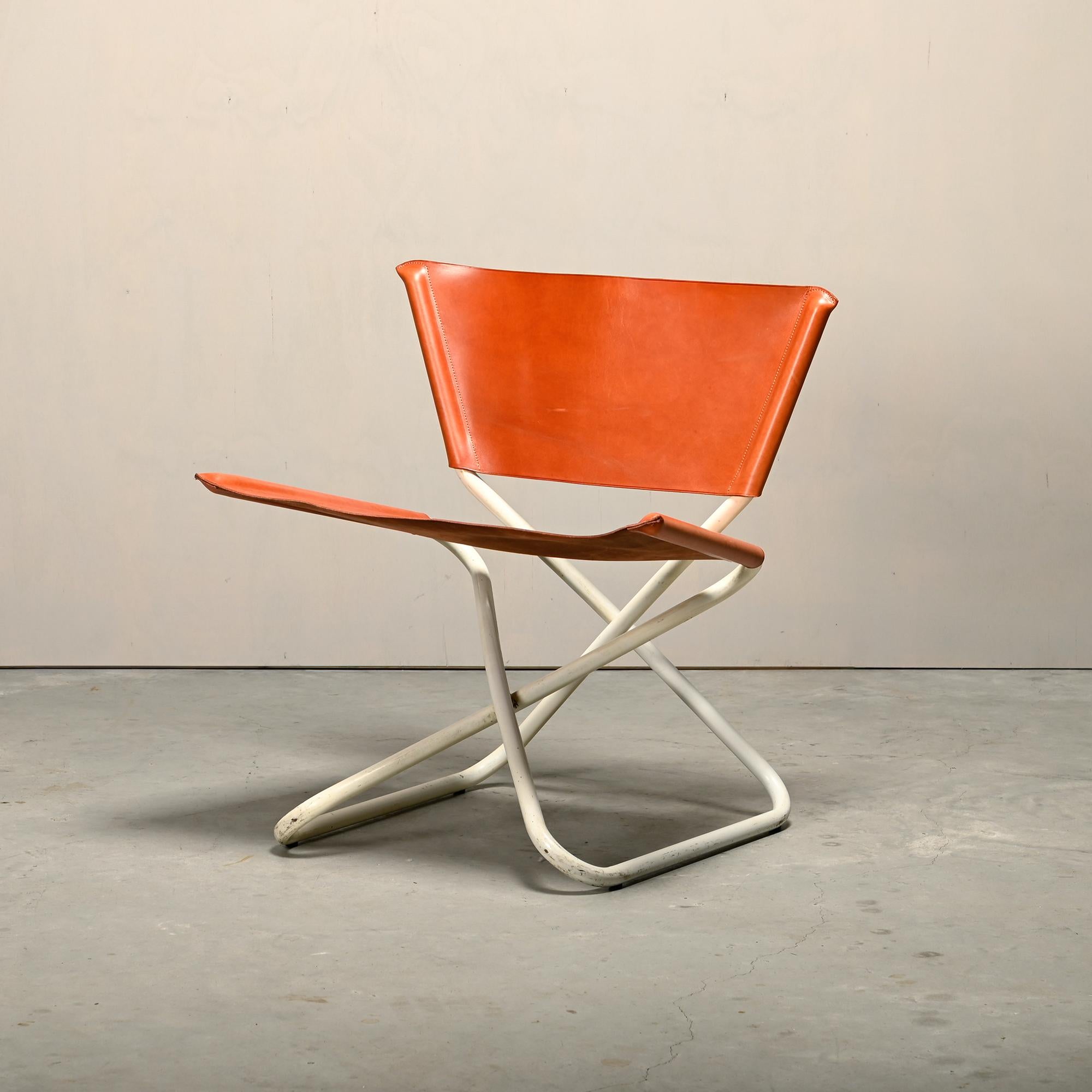 Erik Magnussen Z Down folding lounge chair for Torben Ørskov, Denmark, 1960s. Clever design with a surprisingly comfortable seat. White enameled steel with saddle leather seat and back. Good condition with light patina and signs of wear, primarily