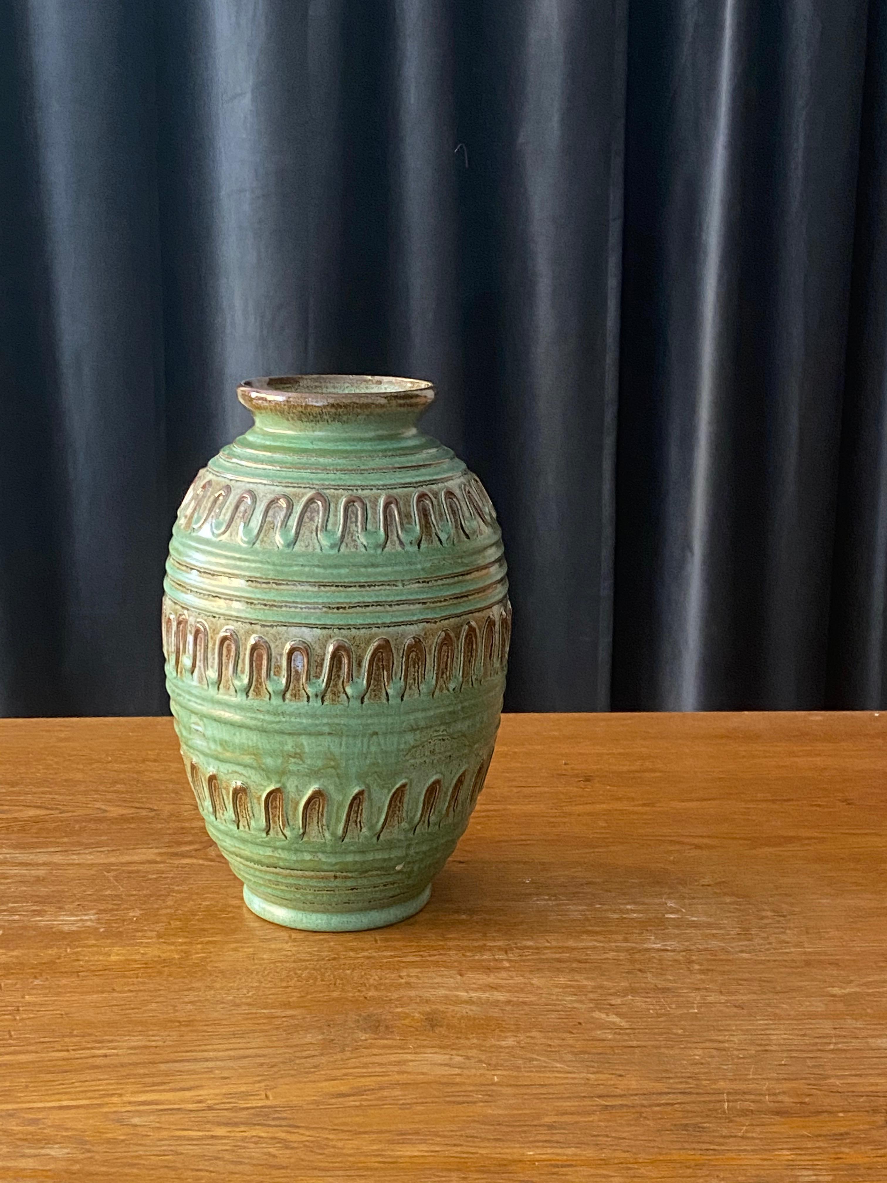 A rare ceramic vase by Erik Mornils for Nittsjö. Produced in Sweden, 1940s. Signed and labeled. 

Has an expression similar to that of works by Wilhelm Kåge, Arne Bang or Axel Salto.