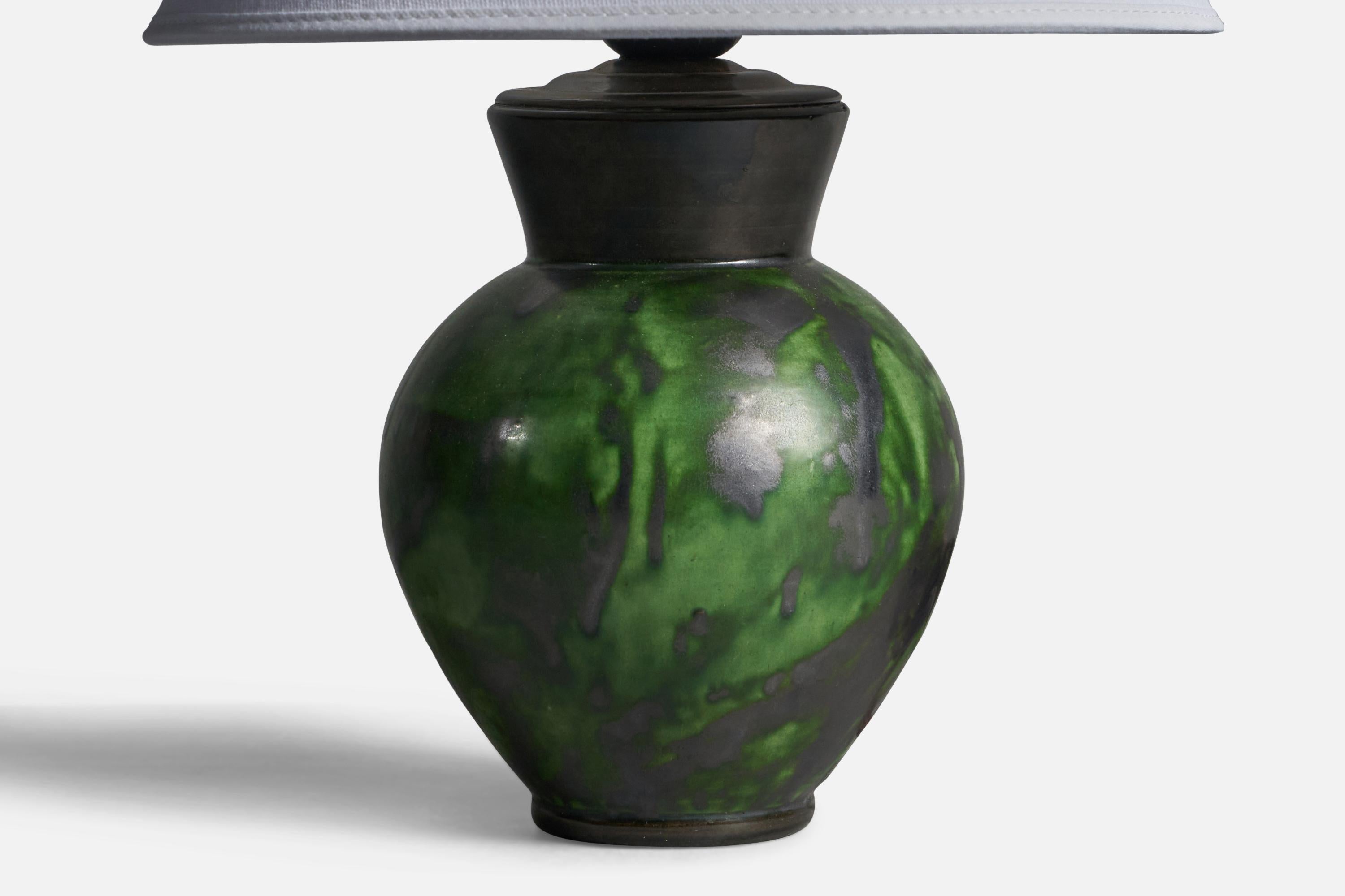 A green-glazed earthenware table lamp designed by Erik Mornils and produced by Nittsjö, Sweden, 1930s.

Dimensions of Lamp (inches): 9.5