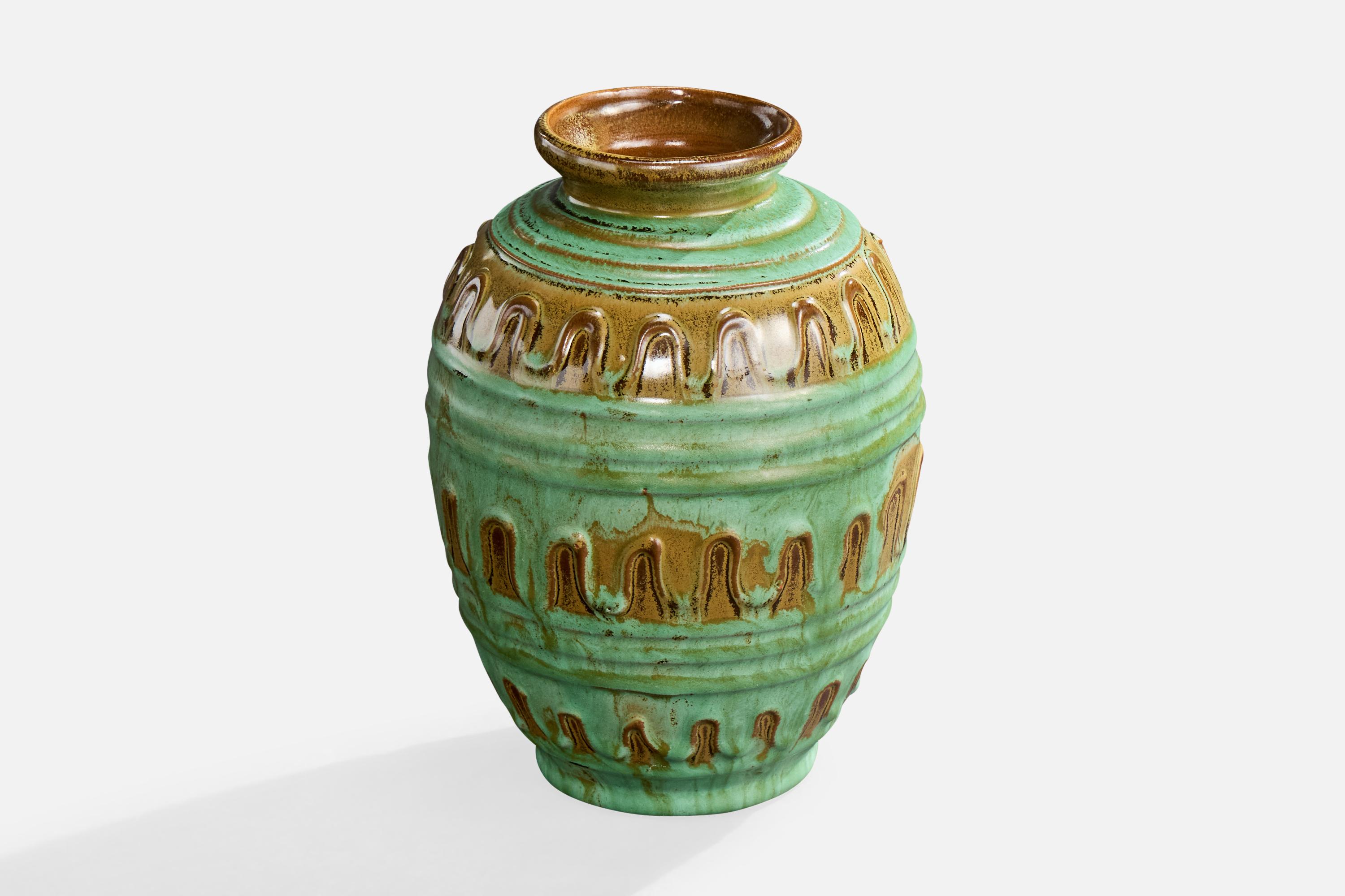 A green and brown-glazed ceramic vase designed by Erik Mornils and produced by Nittsjö, Sweden, c. 1930s.

Overall Dimensions (inches): 6.0
