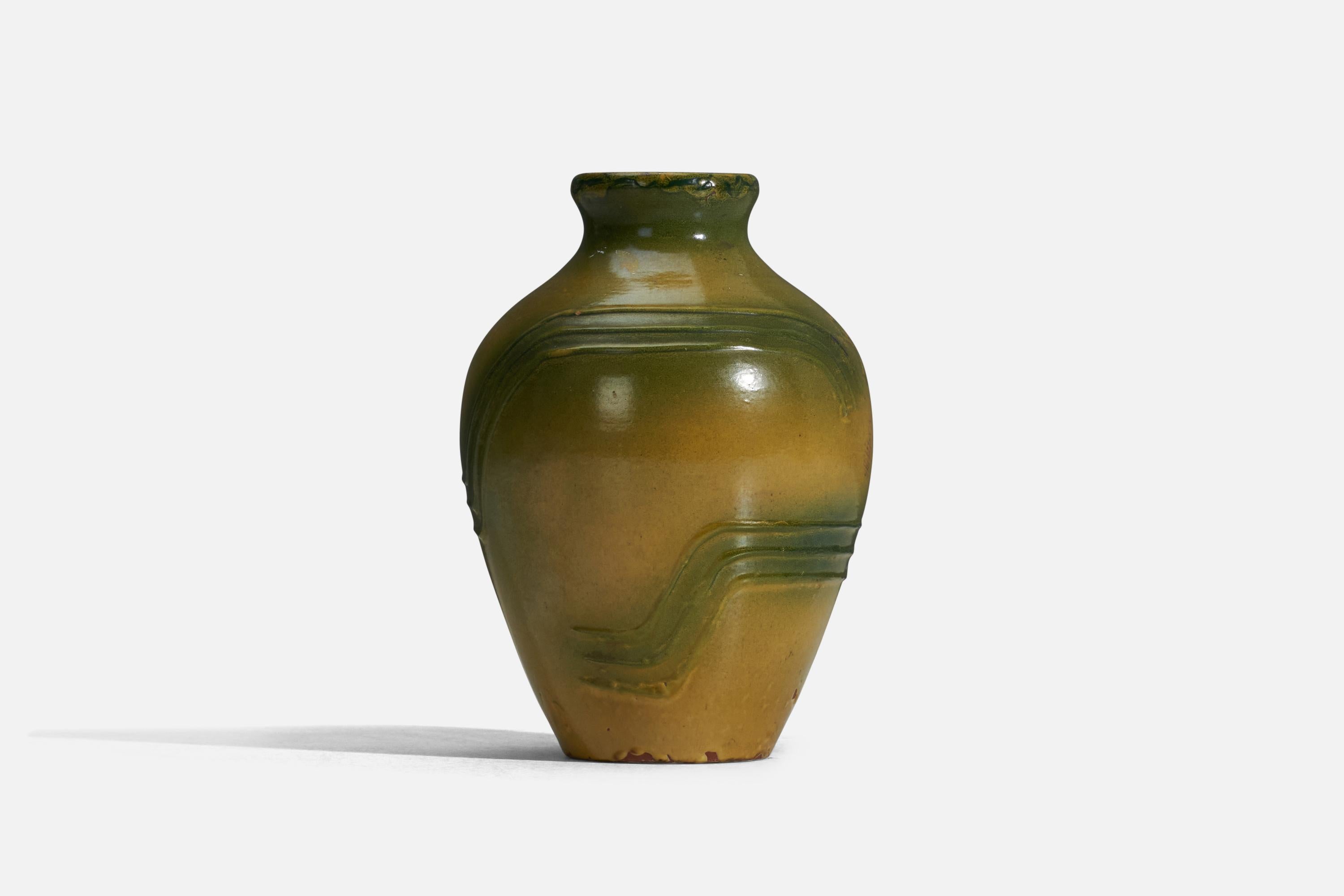 A green and yellow glazed earthenware vase designed by Erik Mornils and produced by Nittsjö, Sweden, 1940s.