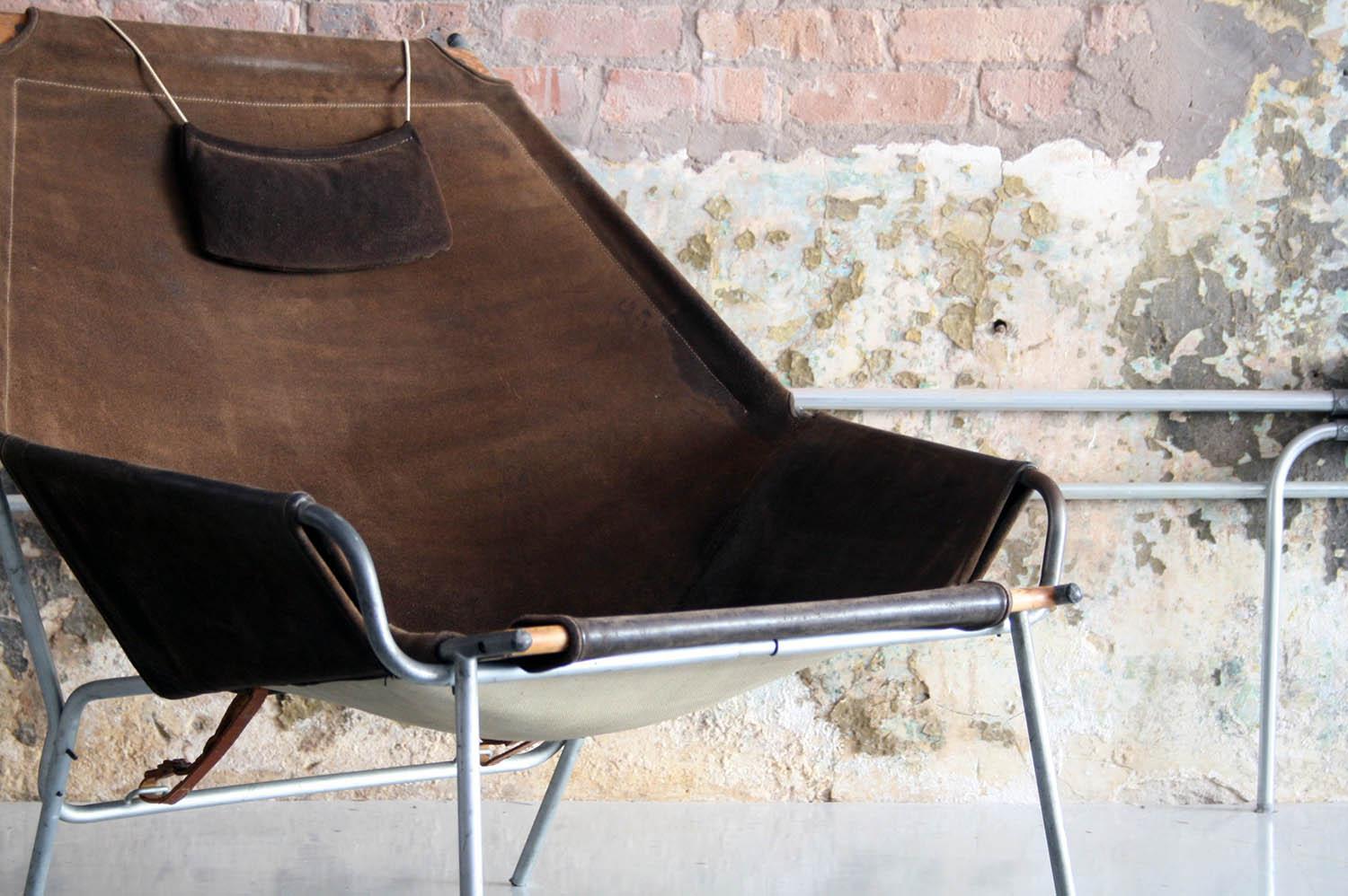 Erik Ole Jorgensen leather lounge chair with metal and teak frame for Bovirke, Denmark. This all original example has a beautiful patina and is seldom seen. 

