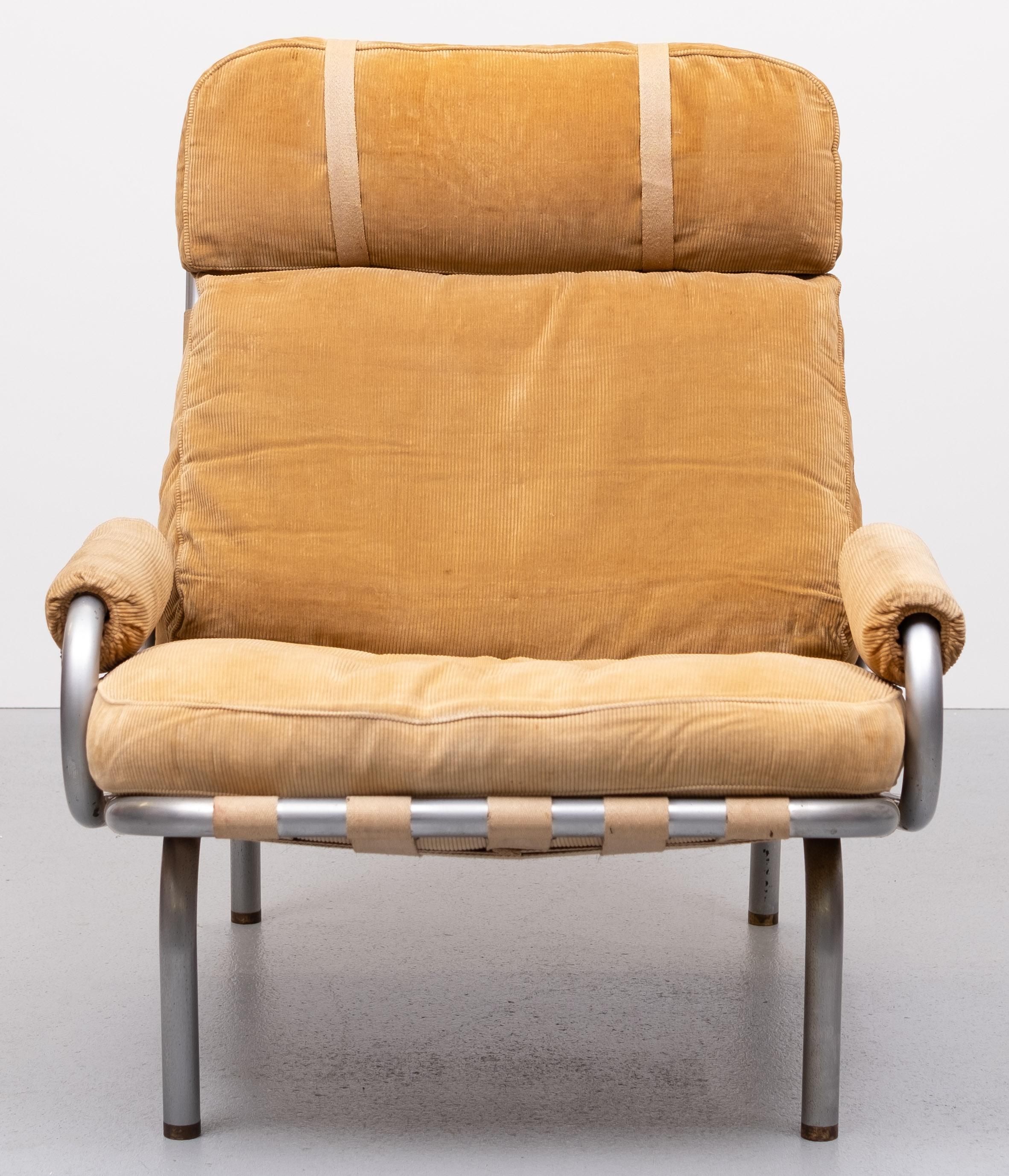 For Sale this beathiful lounge chair . Original Sand color ripcord . 
Steel Tube frame .Brass feet . Canvas strapping . Brass buckles . 
Design by  Erik Ole Jørgensen for Manchers Mobler  1960s .
Very rare model .