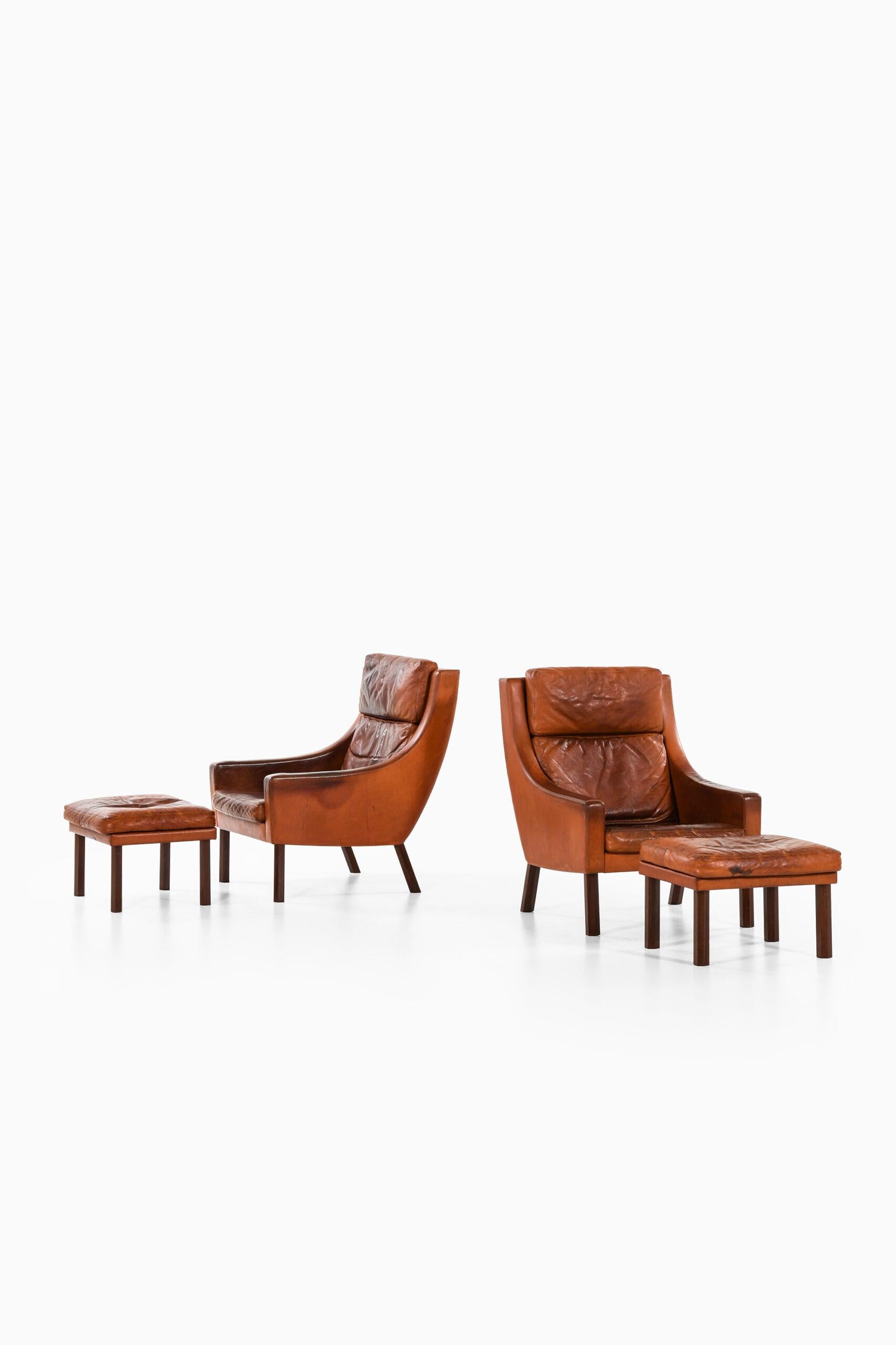 Leather Erik Ole Jørgensen Easy Chairs with Stools Produced by Selectform in Denmark For Sale