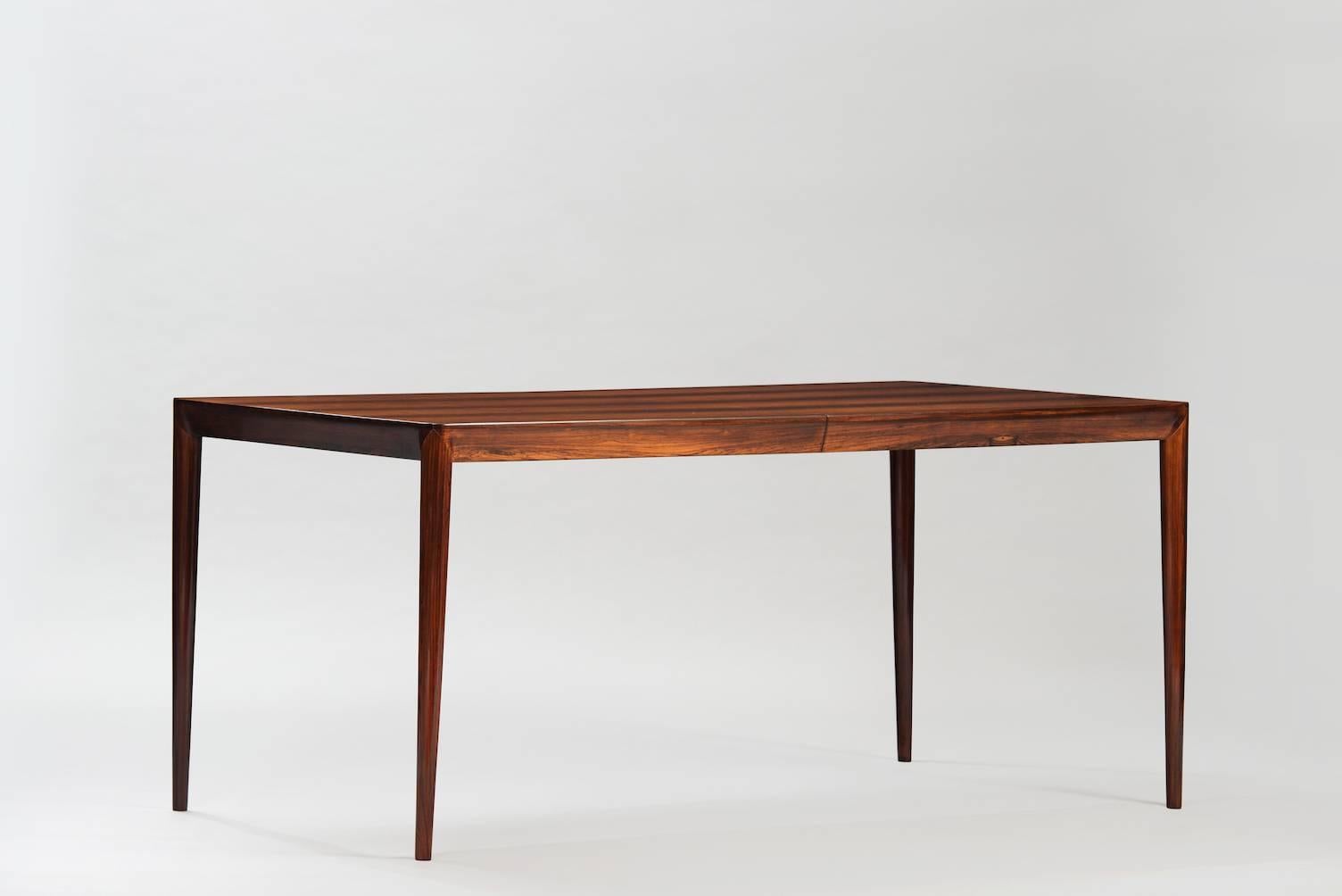 Rosewood rectangular extendable dining table.