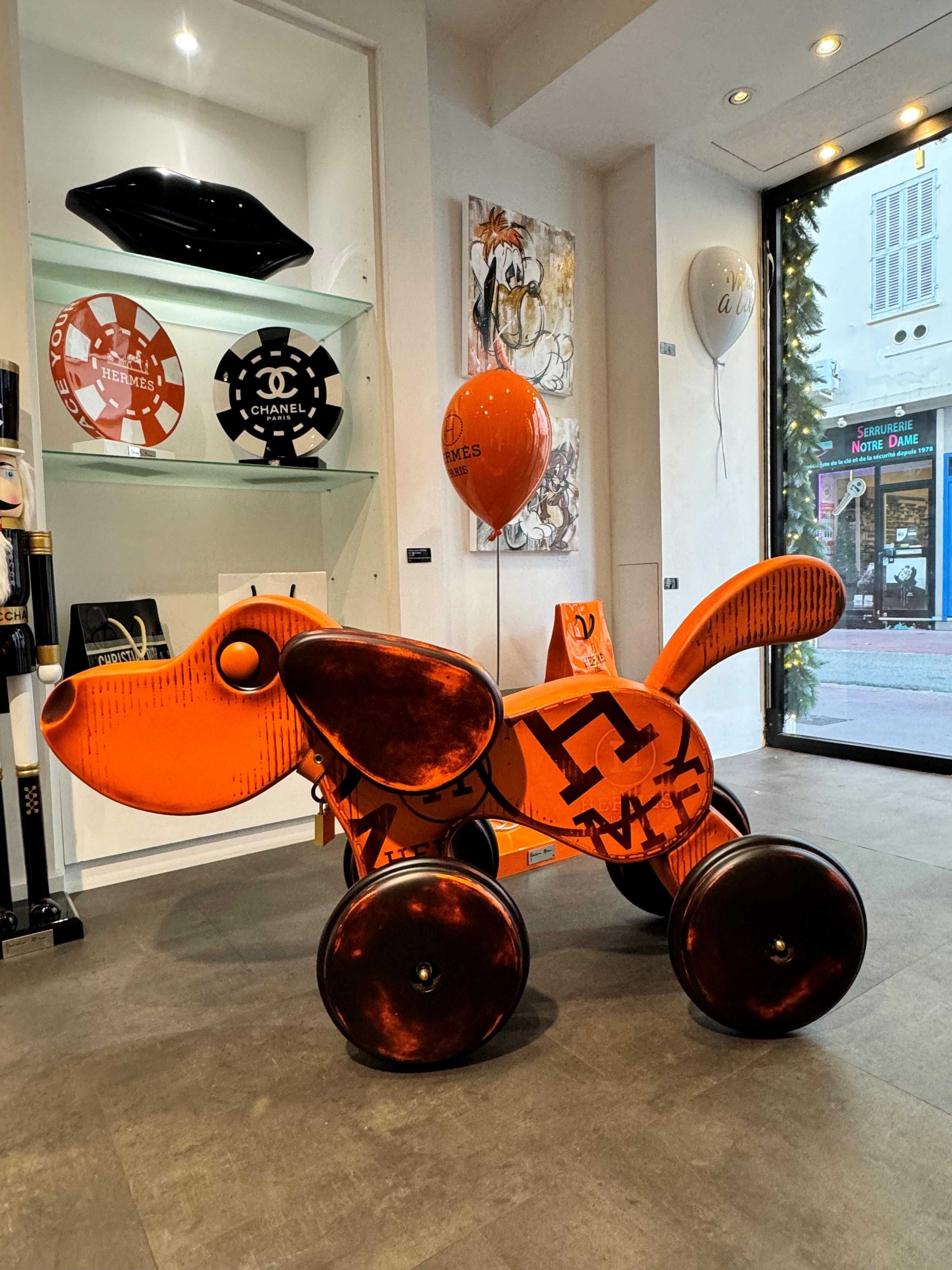 Original - Mixed media sculpture.

Colourful and exquisitely finished toy dog sculpture in bright orange.

Influenced by the Pop Art movement, Erik Salin's figurative artistic approach diverts objects from their context creating wonderful eye