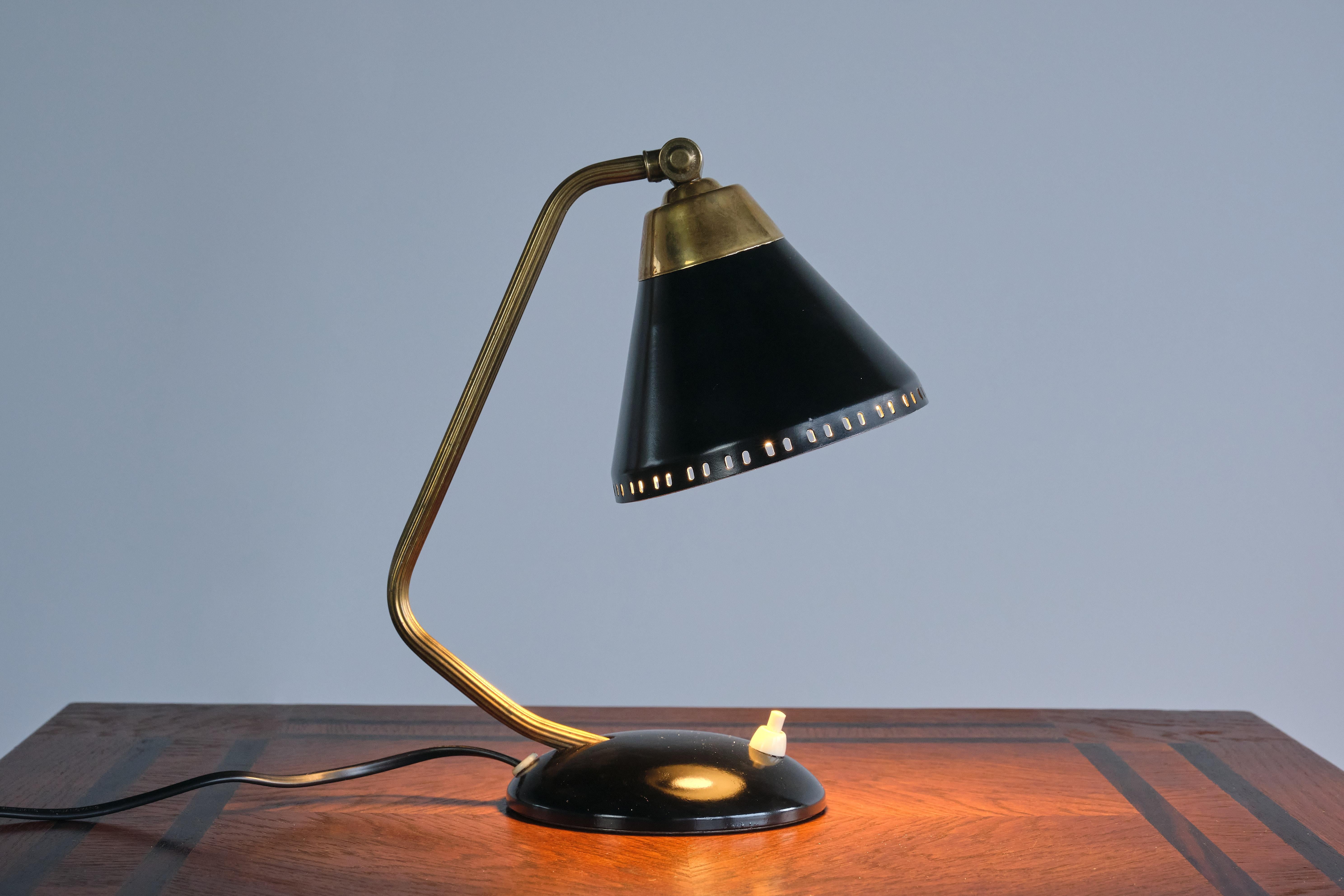 This rare table or desk lamp was designed by Erik Wärnå in the 1950s. It was produced by his company EWÅ in Värnamo, Sweden. The lamp is signed with the manufacturers stamp on the underside.

This Swedish Modern design is marked by the rounded base