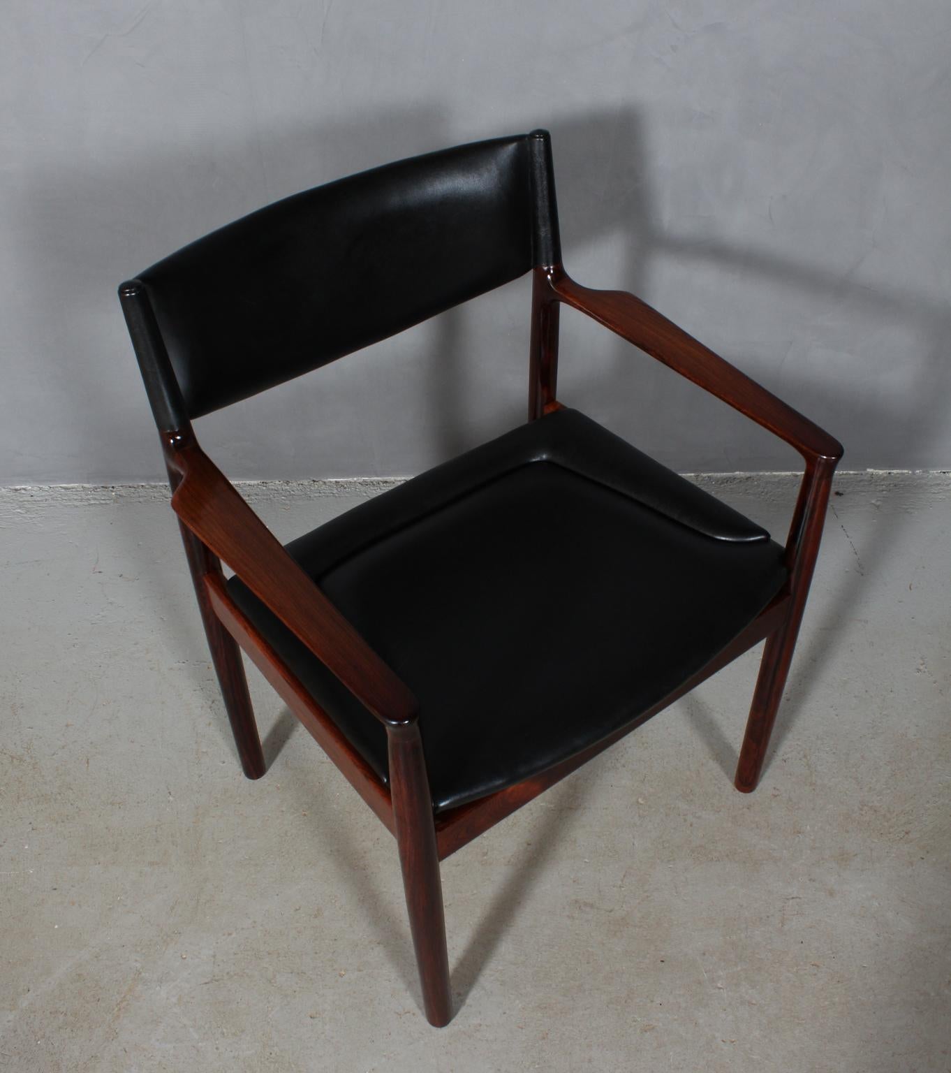 Erik Wørts armchair in solid rosewood.

Upholstered with black leather.

Model Erika, made by Vamo.