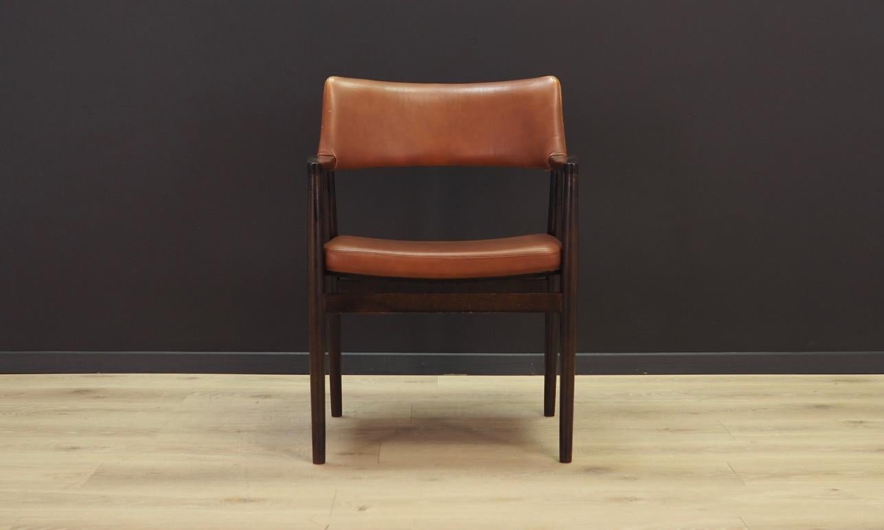 Set of four armchairs from the 1960s-1970s. Scandinavian style, Minimalist form - design by Erik Wørts. Manufactured in Sorø Stolefabrik. Original upholstery made of leather in brown, oak construction. Maintained in good condition (minor bruises,