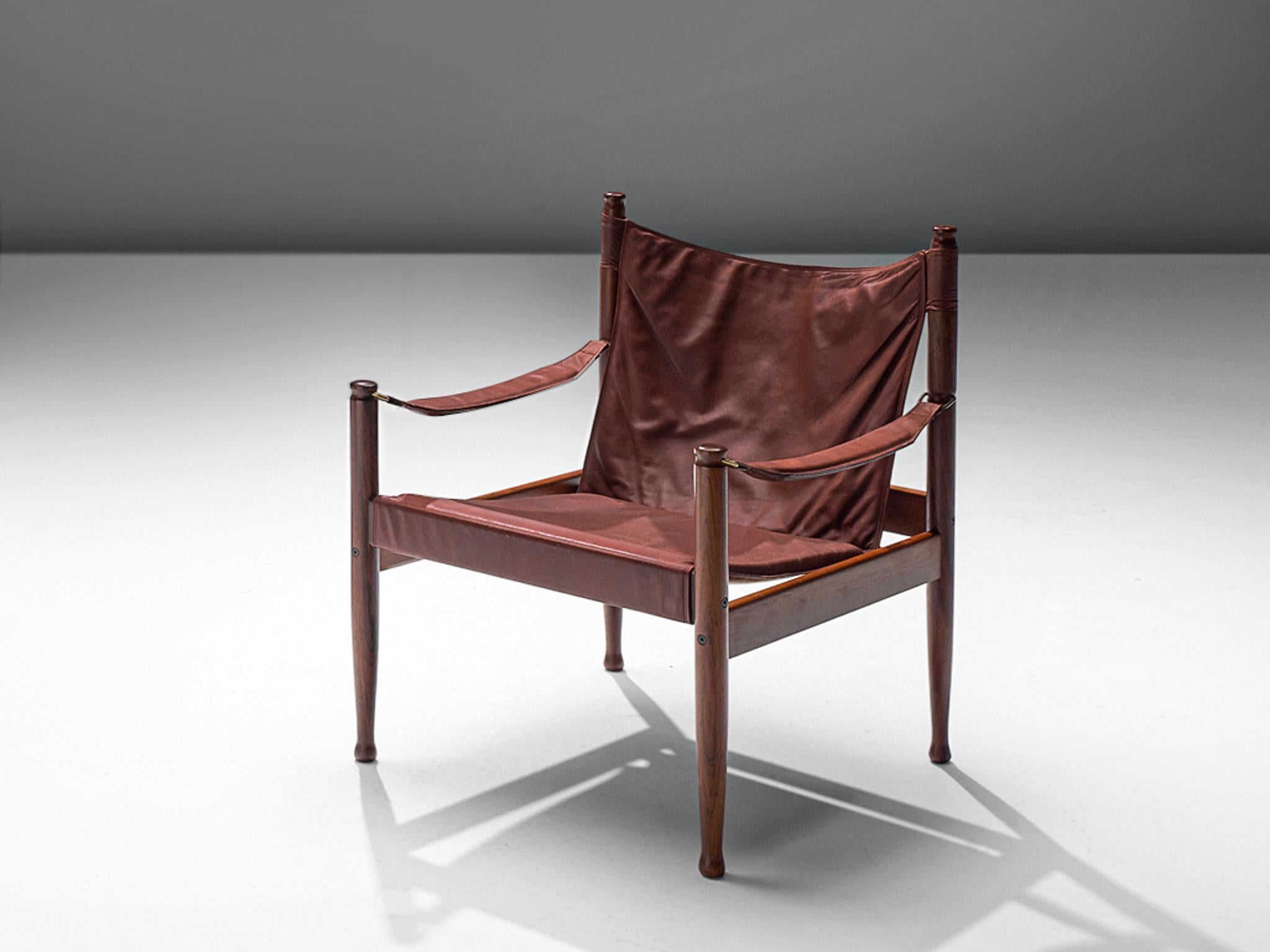 Erik Wørts for Niels Eilsersen, armchair, oak and leather, Denmark, 1960s, later production. 

This sturdy lounge chair with refined details is designed by Danish designer Erik Wørts. The safari easy chair has a strong expression due to the