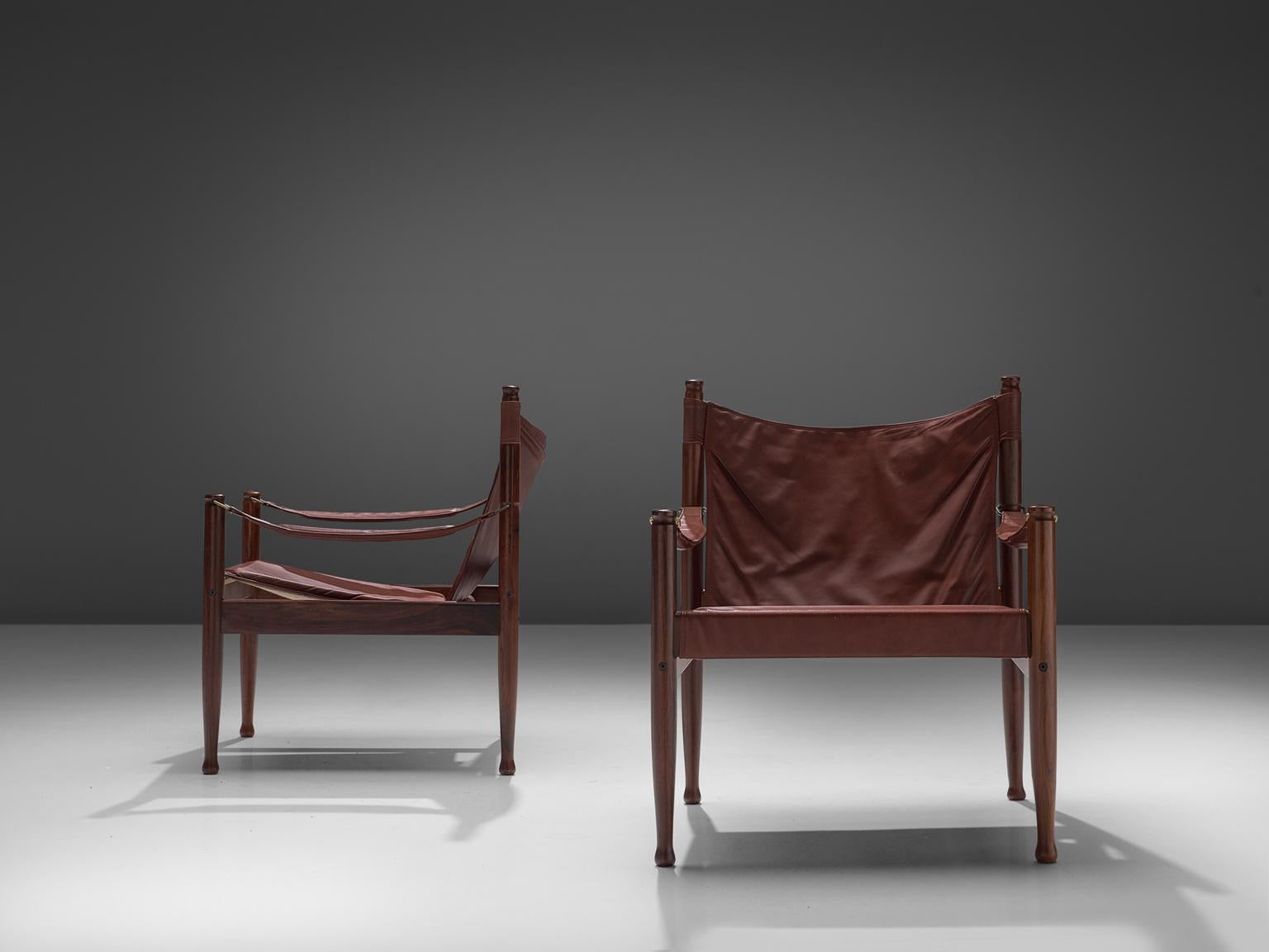 Erik Wørts for Niels Eilsersen, set of three armchairs, rosewood and leather, Denmark, 1960s. 

These sturdy lounge chairs with refined detail are designed by Danish designer Erik Wørts. The safari easy chairs have a strong expression due to the