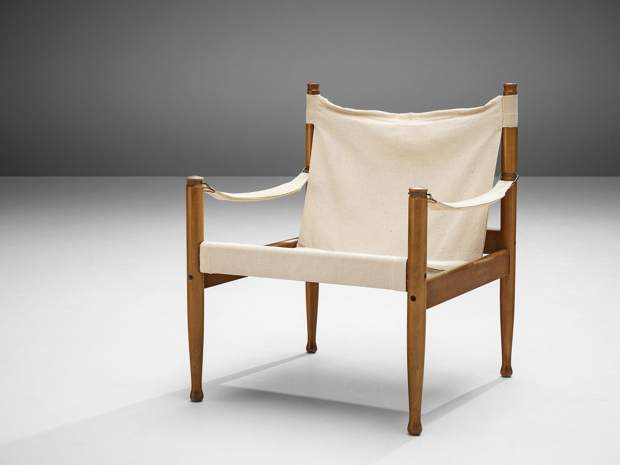 Erik Wørts for Niels Eilsersen, safari chair, stained beech, canvas, Denmark, 1960s 

This sturdy lounge chair with refined details is designed by Danish designer Erik Wørts. The safari easy chair has a sincere and harmonious expression due to the